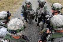 Members of Barksdale’s 2nd Security Forces Squadron discuss their plan during the tactics portion of the Global Strike Challenge at Camp Minden, La., Nov. 13.  Global Strike Challenge is the world's premier bomber, Intercontinental Ballistic Missile and security forces competition with units from Air Force Global Strike Command, Air Combat Command, Air Force Reserve Command and the Air National Guard. (U.S. Air Force photo/Senior Airman Brittany Y. Bateman)