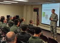 MINOT AIR FORCE BASE, N.D. -- Capt. Jan Liechty, 5th Force Support Squadron military personnel section chief, leads a pre-deployment briefing to the 69th Bomb Squadron here Nov. 12. Lt. Col. Michael Cardoza, 69th Bomb Squadron commander, and the Nighthawks are scheduled to deploy to Andersen AFB, Guam, in support of U.S. Pacific Command’s Continuous Bomber Presence, a first for the unit since the Vietnam War. (U.S. Air Force photo/Senior Airman Michael J. Veloz)