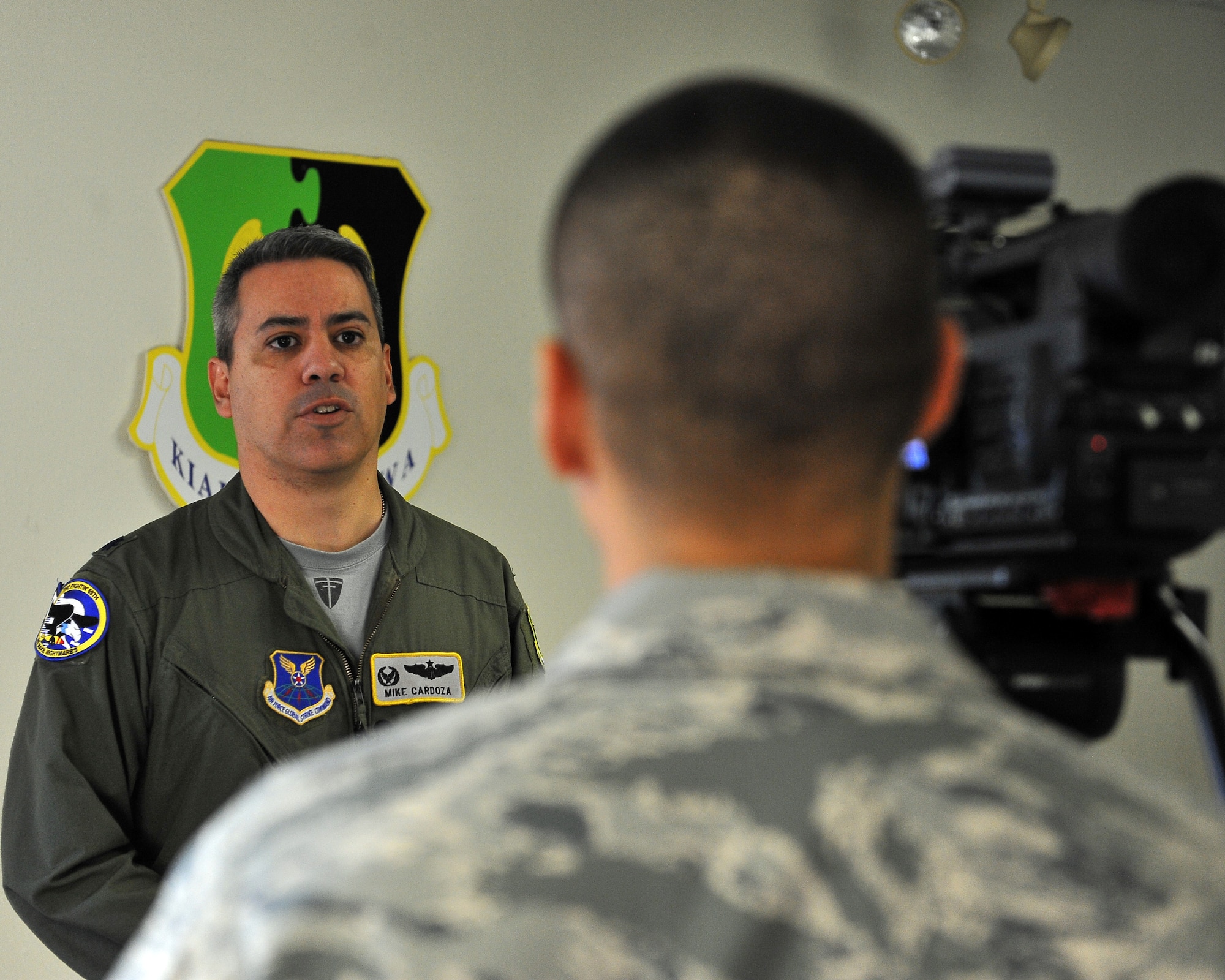 MINOT AIR FORCE BASE, N.D. -- Lt. Col. Michael Cardoza, 69th Bomb Squadron commander, is interviewed by Staff Sgt. Miguel Lara, 5th Bomb Wing public affairs broadcaster, here Nov. 12. Colonel Cardoza and the Nighthawks are scheduled to deploy to Andersen AFB, Guam, in support of U.S. Pacific Command’s Continuous Bomber Presence, a first for the unit since the Vietnam War. (U.S. Air Force photo/Senior Airman Michael J. Veloz)