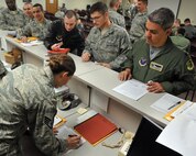 MINOT AIR FORCE BASE, N.D. -- Lt. Col. Michael Cardoza, 69th Bomb Squadron commander, processes through the a deployment processing line here Nov. 12. Colonel Cardoza and the Nighthawks are scheduled to deploy to Andersen AFB, Guam, in support of U.S. Pacific Command’s Continuous Bomber Presence, a first for the unit since the Vietnam War. (U.S. Air Force photo/Senior Airman Michael J. Veloz)