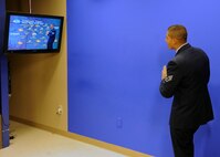 MINOT, N.D. -- Staff Sgt. Miguel Lara, III, 5th Bomb Wing public affairs broadcaster, practices with the blue screen at the KXMC-TV studios during the morning show here Nov. 11. Sergeant Lara was interviewed on Veteran’s Day about what it means to serve in todays military. KXMC also aired a video from Col. Doug Cox, 5th Bomb Wing commander, delivering a message of thanks to all who have served in the armed forces and are presently serving around the world. (U.S. Air Force photo/Staff Sgt. Keith Ballard)