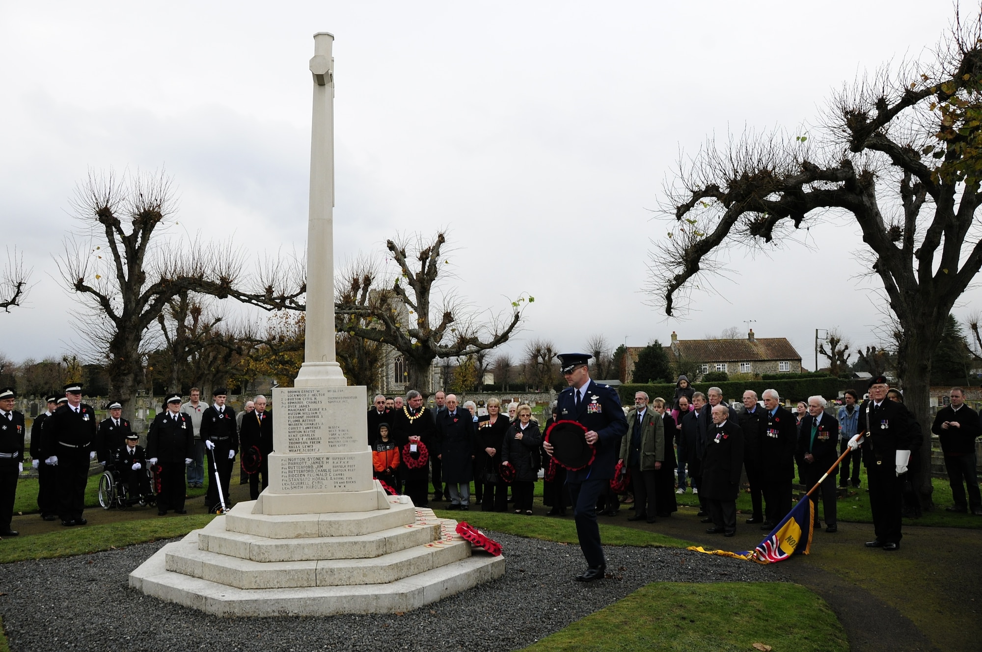 BRANDON, England – Col. Daniel Orcutt, 48th Operations Group commander, prepares to place a wreath of red poppies on the Brandon War Memorial during a Remembrance Sunday ceremony Nov. 14. In the U.K., wearing red poppies and laying poppy wreaths at memorial sites is a way to honor those who lost their lives or were injured during war.  (U.S. Air Force photo/Senior Airman Stephen Linch)