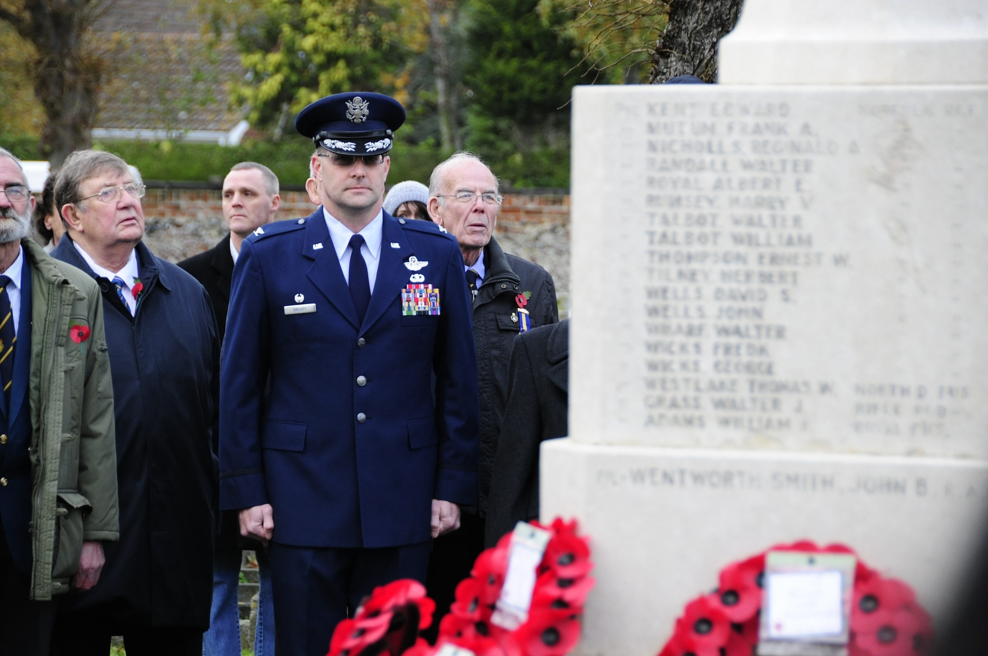 BRANDON, England – Col. Daniel Orcutt, 48th Operations Group commander, stands at attention at the Brandon War Memorial during a Remembrance Sunday ceremony Nov. 14. Remembrance Sunday is similar to the Veterans Day and is a way to honor those who died or were injured in war by wearing red poppies and laying poppy wreaths at memorial sites.  (U.S. Air Force photo/Senior Airman Stephen Linch)