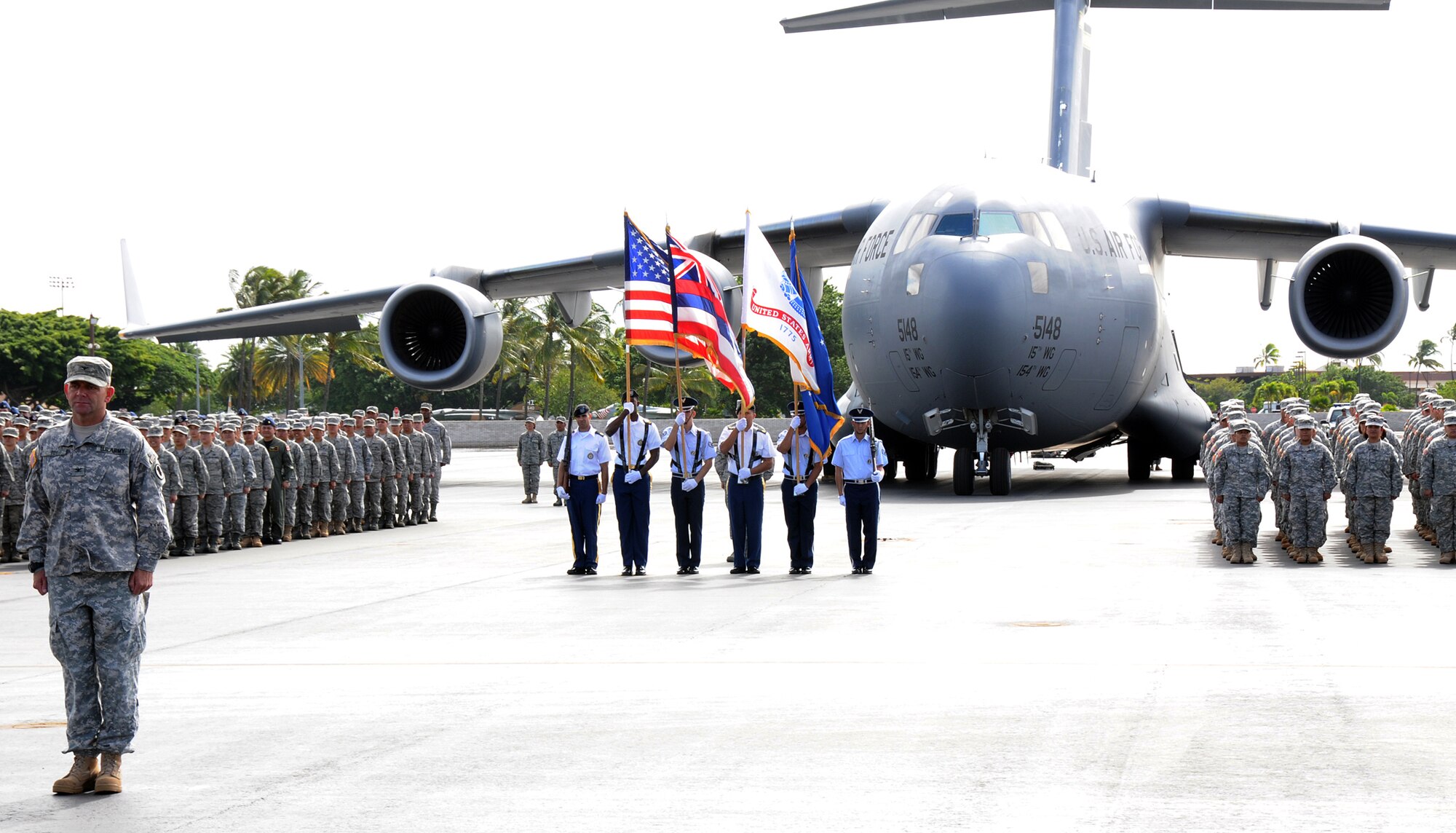 Members of the Hawaii Air and Army National Guard along with the Color Guard stand in formation in front of the C-17 Globemaster III during the retirement ceremony for Maj. Gen. Robert G.F. Lee, Hawaii adjutant general, on Joint Base Pearl Harbor-Hickam, Nov. 6.  Maj. Gen. Lee performed his final troop inspection as the adjutant general as part of the retirement ceremony. (U.S. Air Force photo/Tech. Sgt. Betty J. Squatrito-Martin)