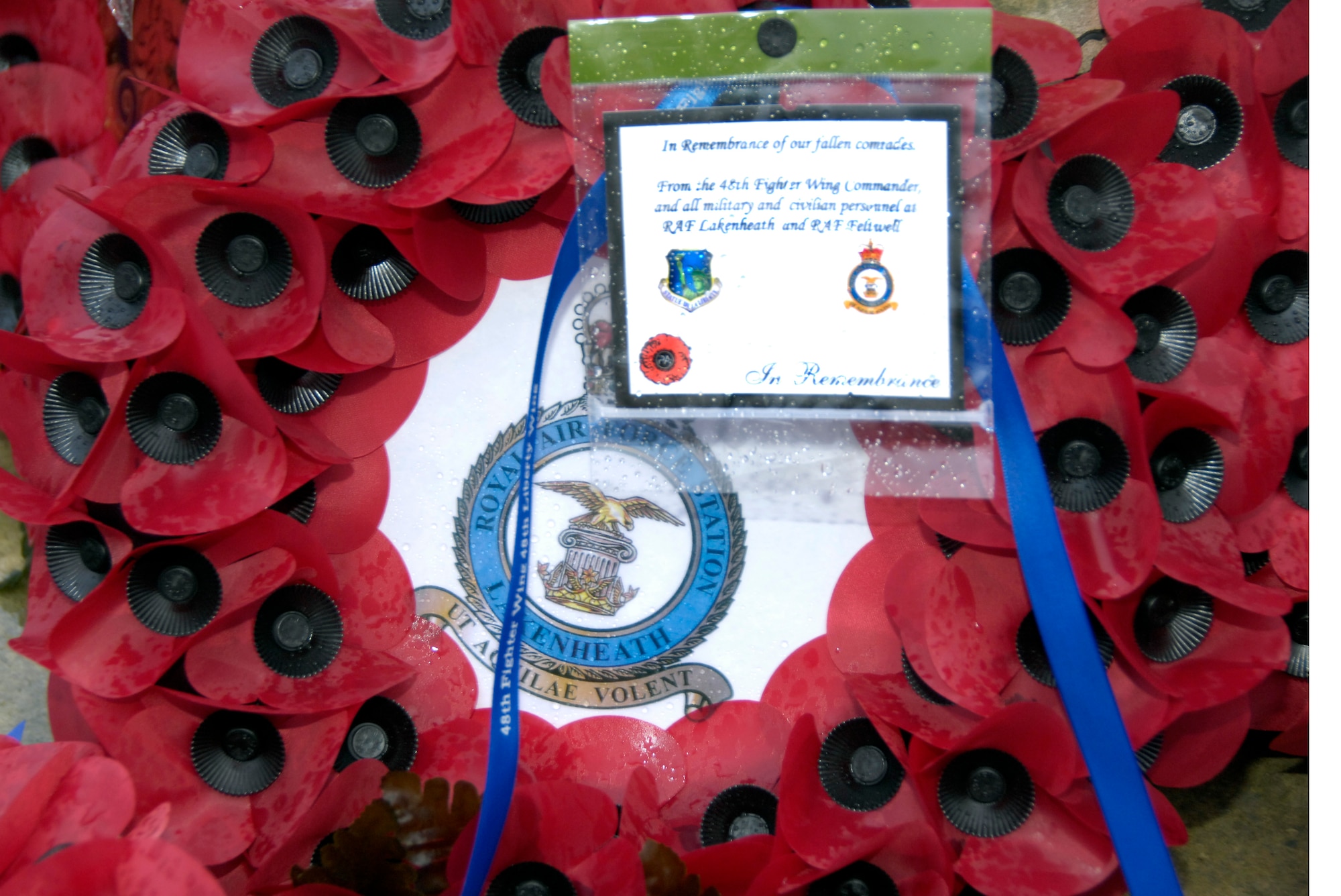 LAKENHEATH, England – This wreath of red poppies was placed by Lt. Col. Kevin Heckle, 48th Force Support Squadron commander, on the Lakenheath War Memorial during a Remembrance Sunday ceremony Nov. 14.  The wreath was from the 48th Fighter Wing Commander, and all military and civilian personnel at RAF Lakenheath and RAF Feltwell. (U.S. Air Force photo/Airman 1st Class Erin Zabarnick) 