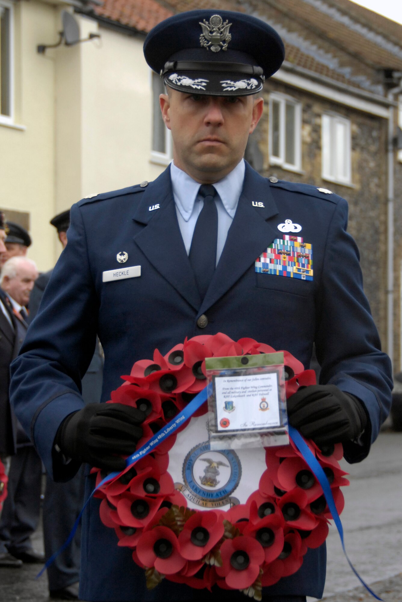 LAKENHEATH, England – Lt. Col. Kevin Heckle, 48th Force Support Squadron commander, prepares to place a wreath of red poppies on the Lakenheath War Memorial during a Remembrance Sunday ceremony Nov. 14.  The wreath laying ceremony was part of a parade to honor and remember fallen servicemembers. (U.S. Air Force photo/Airman 1st Class Erin Zabarnick) 