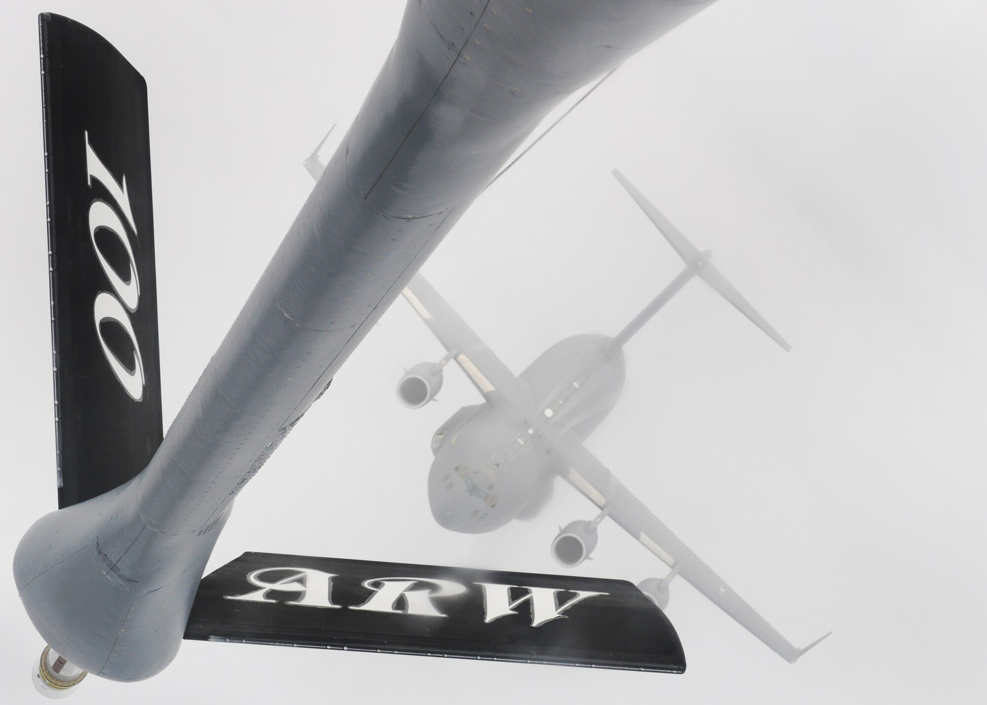 RAF MILDENHALL, England -- A C-17 Globemaster III from the Heavy Airlift Wing, Papa Air Base, Hungary, approaches a 100th Air Refueling Wing KC-135 Stratotanker boom over Germany Nov. 12, 2010.  During the training mission, both units received vital training they don't get the opportunity to do on a regular basis.  (U.S. Air Force photo/Senior Airman Tabitha M. Lee)