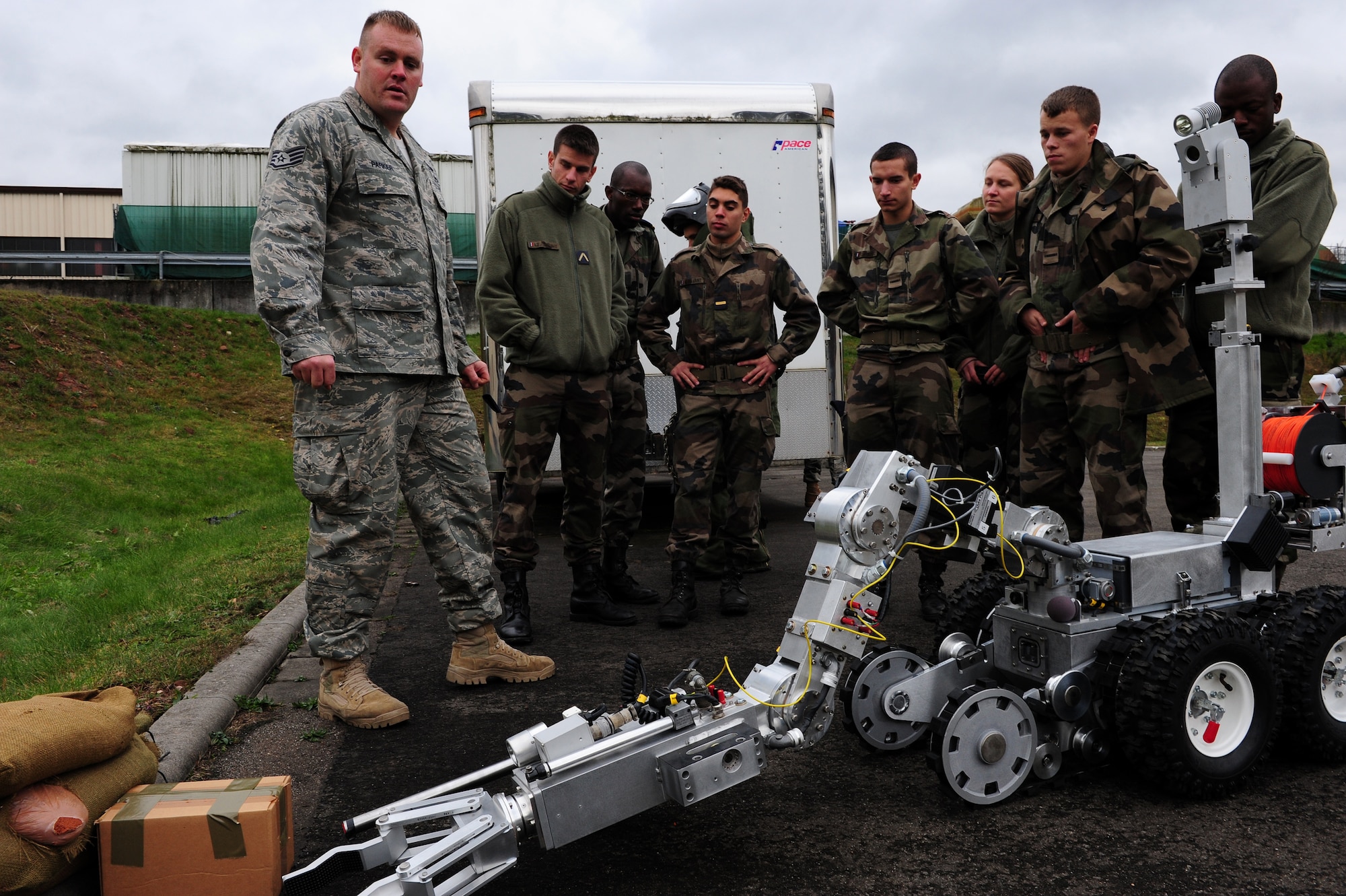 U.S. Air Force Staff Sgt. Kristopher Parker, 886th Civil Engineer Squadron, briefs French air force cadets on particulars of the F6A robot, Ramstein Air Base, Germany, Nov. 16, 2010. The cadets will be visiting several locations on base during the tour.(U.S. Air Force photo by Airman 1st Class Brea Miller)