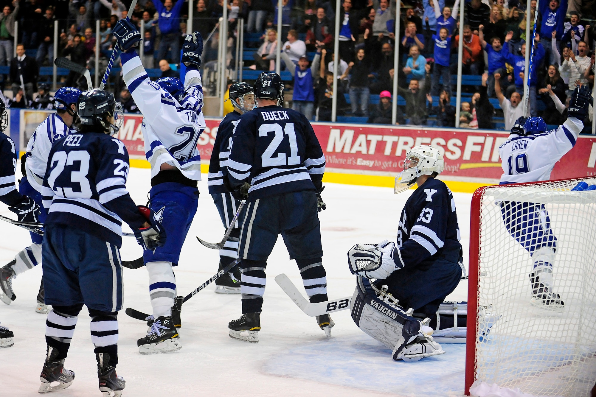 Air Force sophomore forward Stephen Carew skates past the Yale goal in triumph after scoring the go-ahead goal against the Yale Bulldogs with 3:49 remaining in the game at the Cadet Ice Arena Nov. 14, 2010. The Falcons scored four goals in the third period to upset No. 3 Yale, 4-3. (U.S. Air Force photo/Mike Kaplan)