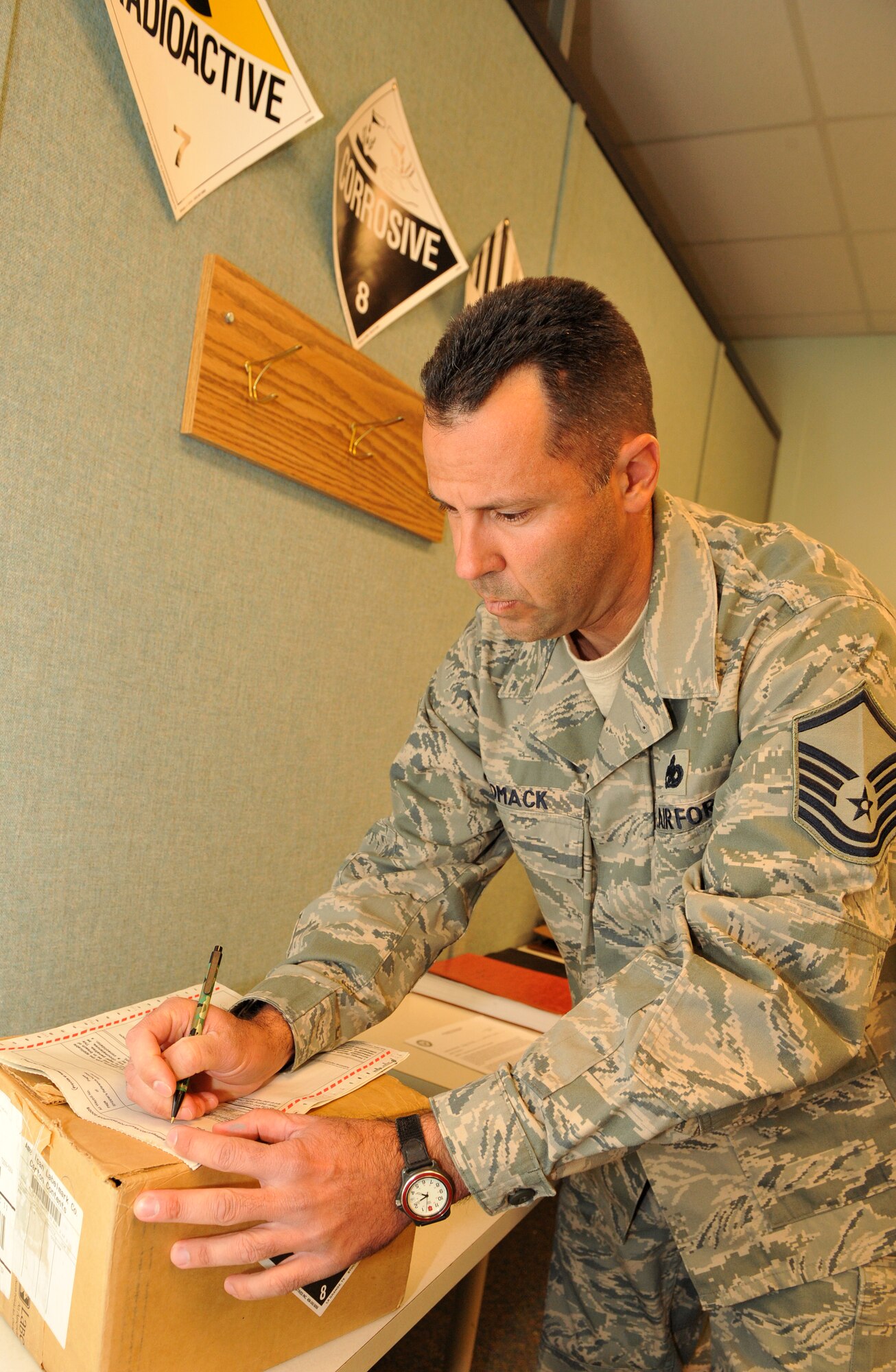 Master Sgt. Kenneth Womack, 96th Aerial Port Squadron special handling superintendent, prepares a hazardous material box Nov. 15, 2010, for cargo shipment at Little Rock Air Force Base, Ark. Sergeant Womack was a lead member of 96th APS Port Dawg Challenge Team. (U.S. Air Force photo by Senior Airman Gul Crockett)