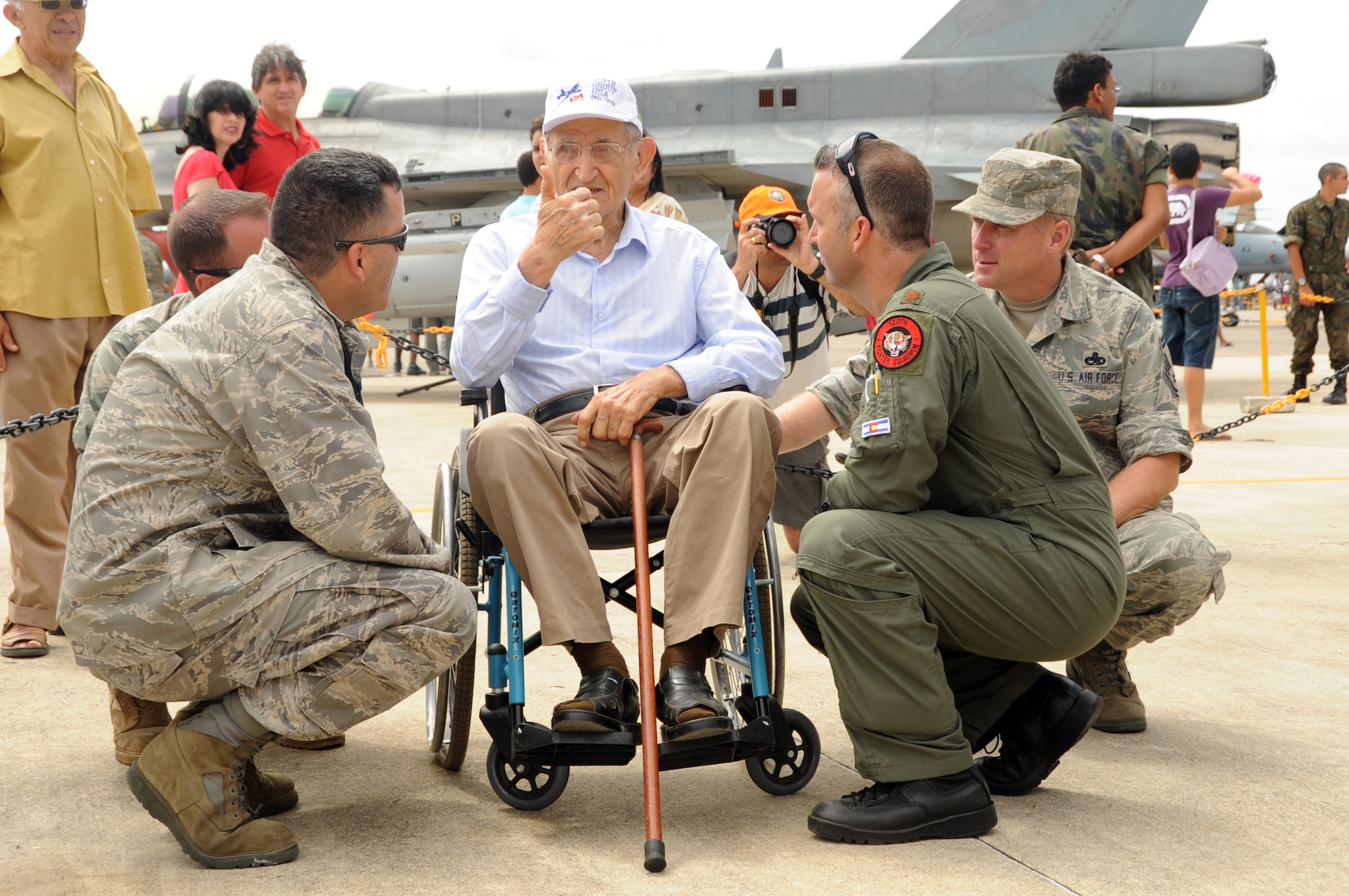 Emil Anthony Petr visits with members of the 161st Air Refueling Wing, Phoenix, Arizona and the 140th Wing, Buckley, Colorado, during an open house at Natal Air Base, Brazil in conjunction with CRUZEX V. Mr. Petr is a World War II veteran who currently lives in Natal. CRUZEX, or Cruzeiro Do Sul (Southern Cross), is a multi-national combined exercise involving the Air Forces of Argentina, Brazil, Chile, France and Uruguay, and observers from numerous other countries with more than 82 aircraft and almost 3,000 Airmen involved. (U.S. Air Force photo/Staff Sgt. Michael Matkin)