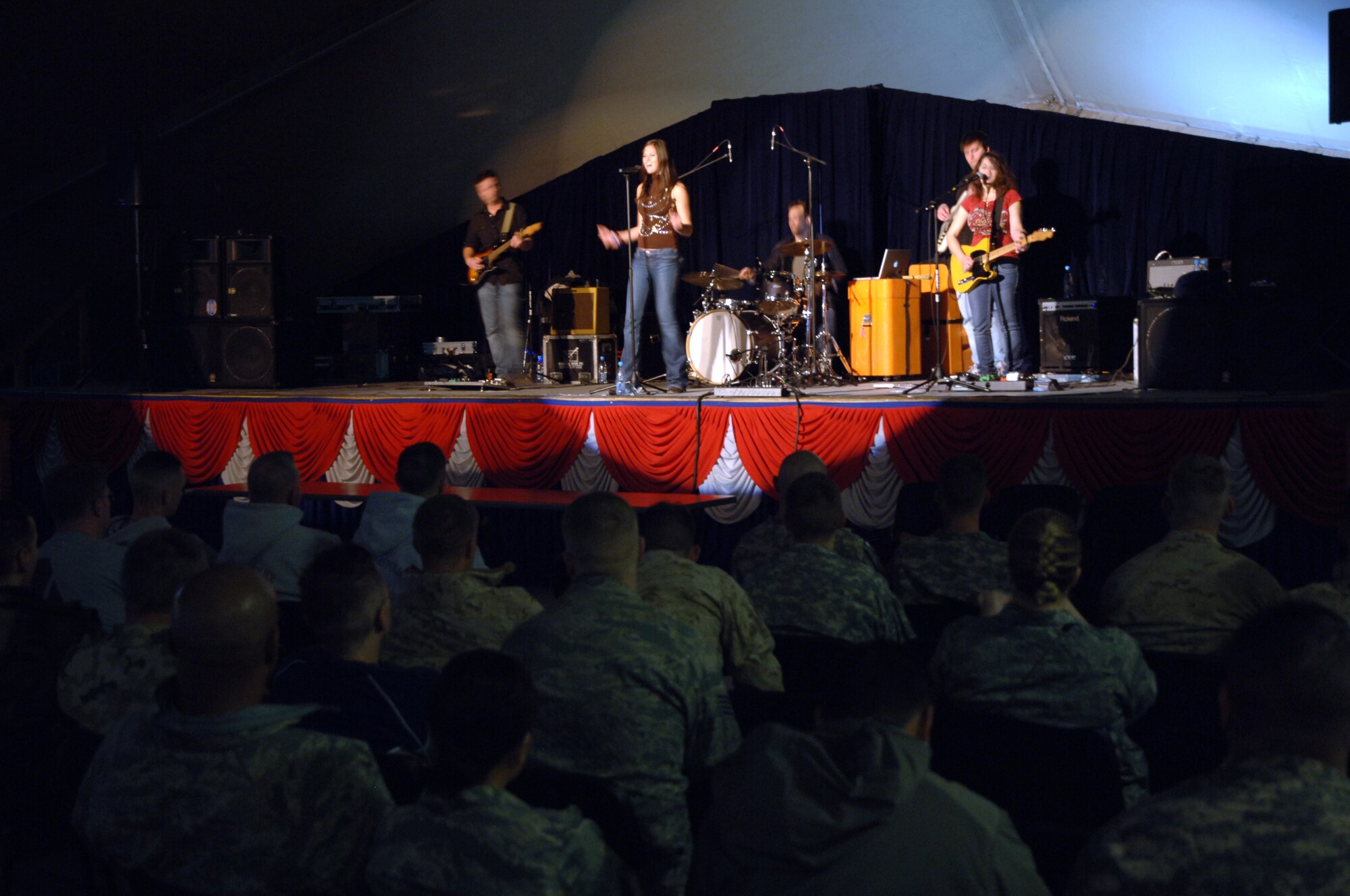 TRANSIT CENTER AT MANAS, Kyrgyzstan - Ms. Ayla Brown performs with her band on stage at Pete's Place for over 500 deployed military members during an Armed Forces Entertainment tour at the Transit Center at Manas Nov. 11.  Ms. Brown, American Idol semifinalist, received a cultural tour of Bishkek, a tour of a KC-135 Stratotanker and a C-17 Globemaster III, Petroleum, Oil and Lubricants farm and a military working dog demonstration.  (U.S. Air Force photo/Master Sgt. Paul Cox)