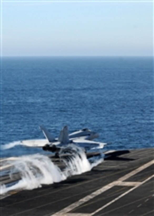 An F/A-18E Super Hornet assigned to Strike Fighter Squadron 147 launches from the aircraft carrier USS Ronald Reagan (CVN 76) after completing a composite training unit exercise on Nov. 14, 2010.  The Ronald Reagan is underway preparing for an upcoming deployment.  