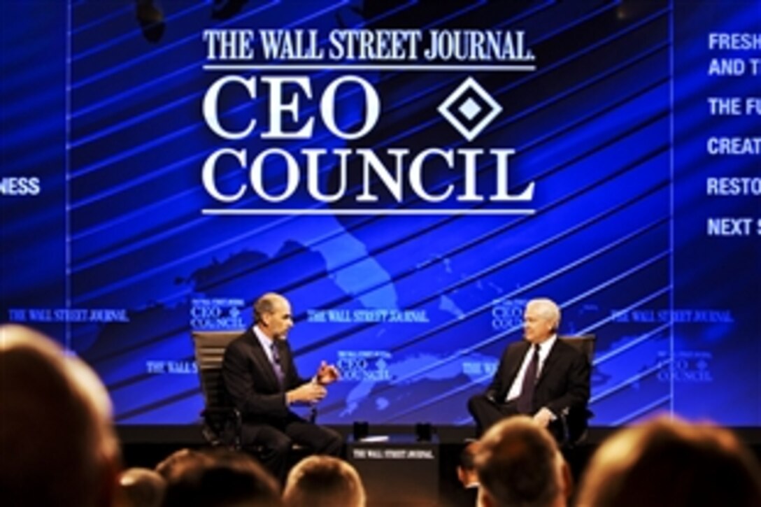 Defense Secretary Robert M. Gates, right, answers questions from Gerald F. Seib, the Wall Street Journal's executive Washington editor, before a large audience at the newspaper's CEO Council in Washington, D.C., Nov. 16, 2010.  The interview focused on upcoming budget cuts within the department. Seib also is the Wall Street Journal's assistant managing editor.