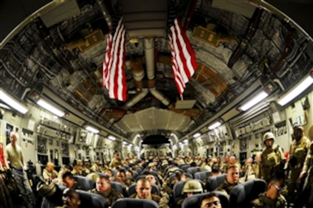 U.S. Navy Seabees fill a C-17 in Kuwait to prepare for a flight to Kandahar, Afghanistan, Nov. 11, 2010. The Seabees are assigned to Naval Mobile Construction Battalion 3, which is a warfighting element deployed to southern Afghanistan to provide construction and engineering support. 