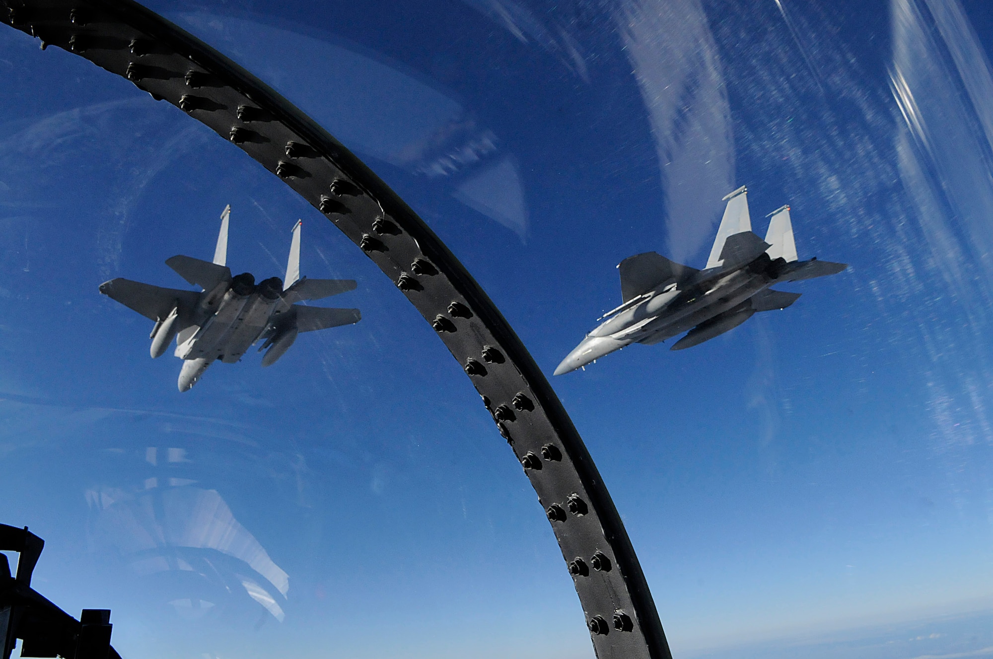A three ship of F-15s from the 44th Fighter Squadron train with Japan Air Self Defense Forces over waters of Hokkaido, Japan, Nov. 17. Twelve jets and nearly 200 Airmen from Kadena are partcipating in an Aviation Training Relocation. Working with Japan Air Self Defense Forces is just one of the goals of the ATR. (U.S. Air Force photo/Tech. Sgt. Mike Tateishi)