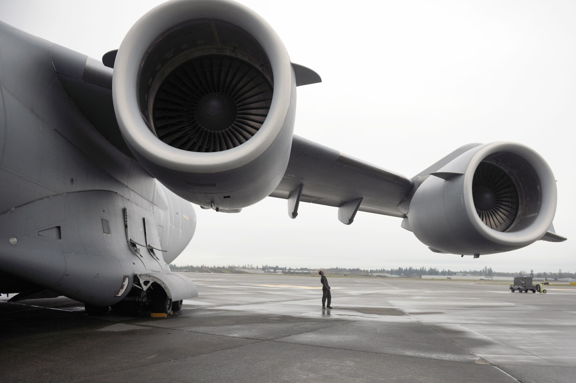 Staff Sgt. Robert Wolf conducts a post-flight maintenance inspection on a C-17 Globemaster III, after a training mission Nov. 13, 2010, at Joint Base Lewis-McChord, Wash. Sergeant Wolf is a 15th Maintenance Squadron C-17 crew chief. (U.S. Air Force photo/Staff Sgt. Mike Meares)