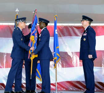 RANDOLPH AIR FORCE BASE, Texas -- Gen. Norton A. Schwartz, left, presents Gen. Edward A. Rice, center, with the AETC colors during a change of command ceremony here Nov. 17. General Rice succeeded Gen. Stephen R. Lorenz, right. (U.S. Air Force photo/Richard McFadden)