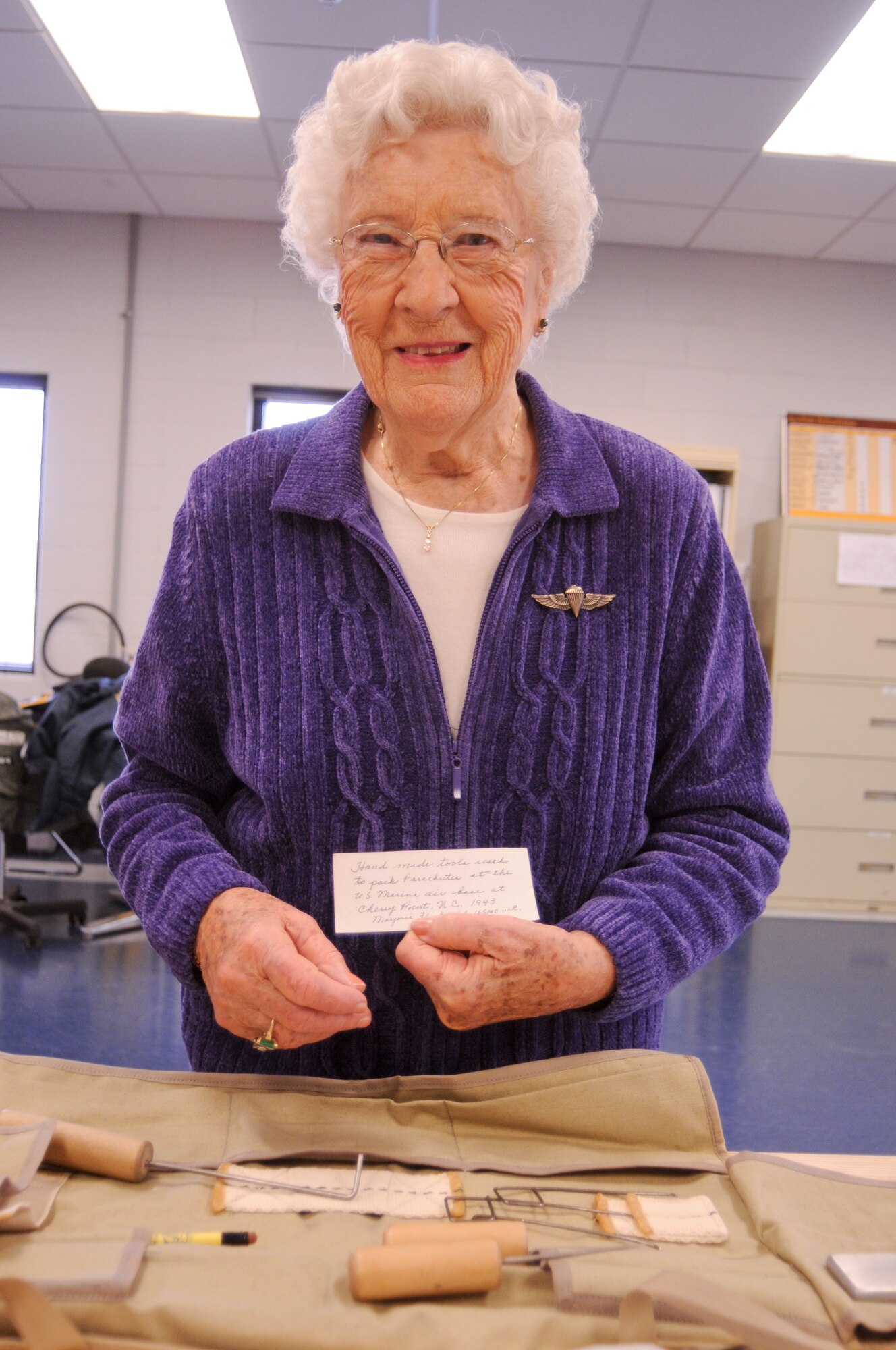 United States Marine Corps Women's Reserve Private Marjorie Flack, a
Pararigger during World War II visits a modern-day parachute shop at the
180th Fighter Wing, Ohio Air National Guard Nov. 17. Mrs. Flack spent time
with parachute technicians of the Aircrew Flight Equipment shop learning
about today's parachute rigging and packing technologies, while also taking
a trip down memory lane, explaining the differences in parachute rigging
during WWII.