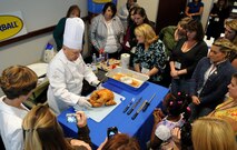 SEYMOUR JOHNSON AIR FORCE BASE, N.C. ? Master Chef Tony Seta explains the technique of carving a turkey to the guests of the Military Spouse Butterball University at Butterball Headquarters in Garner, N.C., Nov. 16, 2010. Participants observed how to prepare, stuff, bake, and carve a turkey. Each participant was awarded a certificate of completion and a gift bag including an apron, meat thermometer, and a coupon towards a Butterball turkey.(U.S. Air Force photo/Senior Airman Makenzie Lang)(RELEASED)