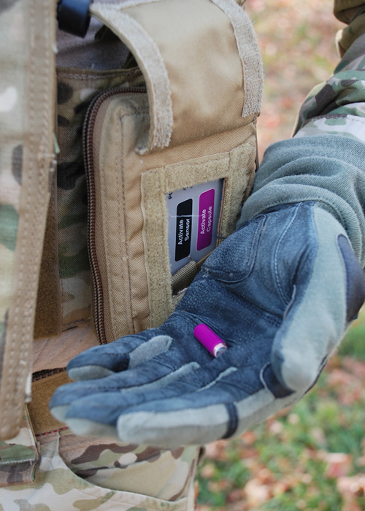 Master Sgt. Robert Bean holds a wireless capsule that when ingested, measures core body temperature Oct. 12, 2010. A receiver unit worn on Sergeant Bean's vest transmits the information to a computer for health status monitoring. The capsule is part of the Battlefield Automatic Life Status Monitor being developed by QinetiQ in coordination with the Human Effectiveness Directorate. Sergeant Bean is from the Air Force Materiel Command Aeronautical Systems Command, Battlefield Airman Branch. (U.S. Air Force photo/Chris Gulliford)
