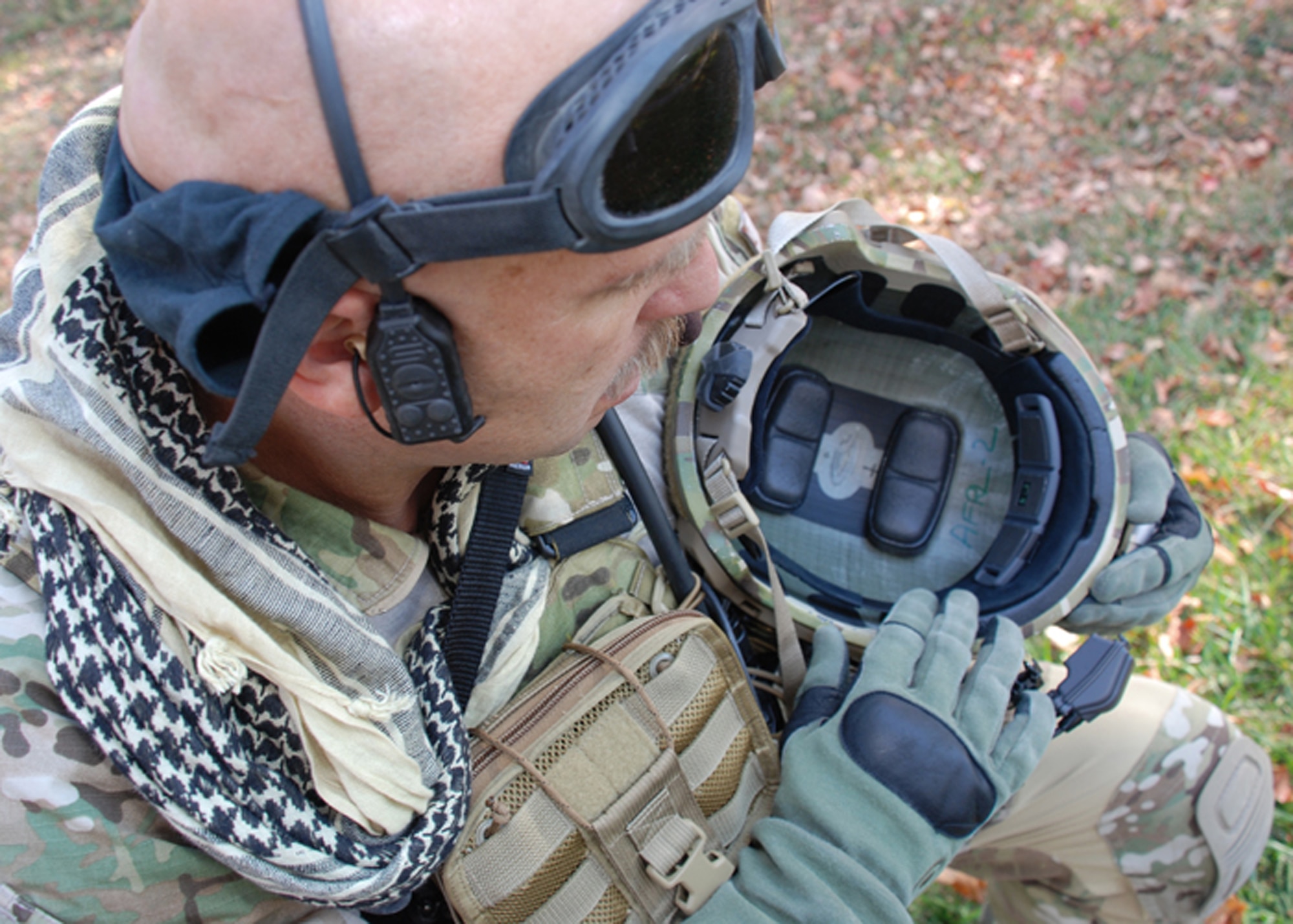 Master Sgt.Robert Bean inspects the wireless pulse oximetry sensor in the front of his helmet, Oct. 12, 2010. The sensor is part of the Battlefield Automatic Life Status Monitor being developed by QinetiQ in coordination with the Human Effectiveness Directorate. Sergeant Bean is from the Air Force Materiel Command Aeronautical Systems Command, Battlefield Airman Branch. (U.S. Air Force photo/Chris Gulliford)
