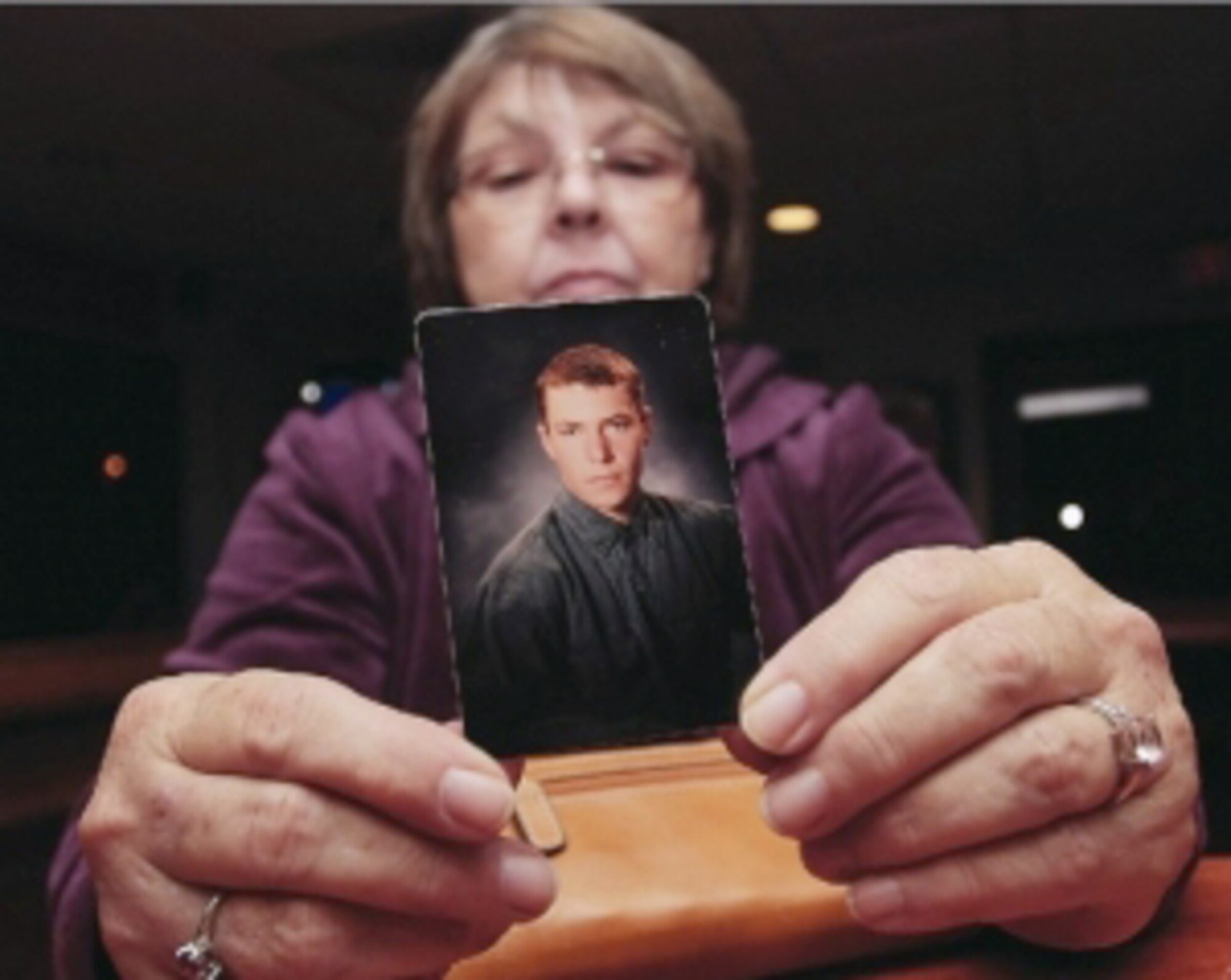 Janet Monti holds up a picture of her son, Army Staff Sgt. Jared Monti, inside the 333rd Fighter Squadron lounge Nov. 9, 2010, at Seymour Johnson Air Force Base, N.C. The following day, Ms. Monti took flight in honor of her son. (Courtesy photo/News-Argus/Michael Betts)