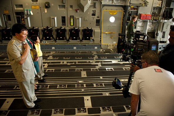 Actors from the TV show Hawaii Five-0 prepare for a scene the back of a C-17 Globemaster III Oct. 11. The cast and crew of the hit show are on Joint Base Pearl Harbor Hickam filming scenes for a recent episode of the show. (U.S. Air Force Photo/Master Sgt. Jeffrey Allen) 