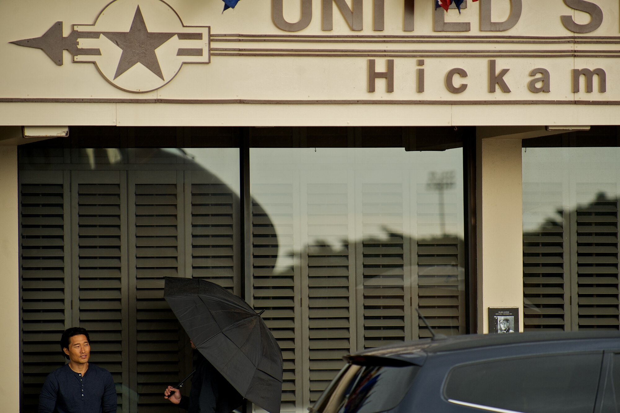 Daniel Dea Kim, an actor on the TV show Hawaii Five-0, waits for the film crew to set up the next scene on Oct. 11. Joint Base Pearl Harbor-Hickam hosted the cast and crew of the hit show during filming for a recent episode. (U.S. Air Force Photo/Master Sgt. Jeffrey Allen)