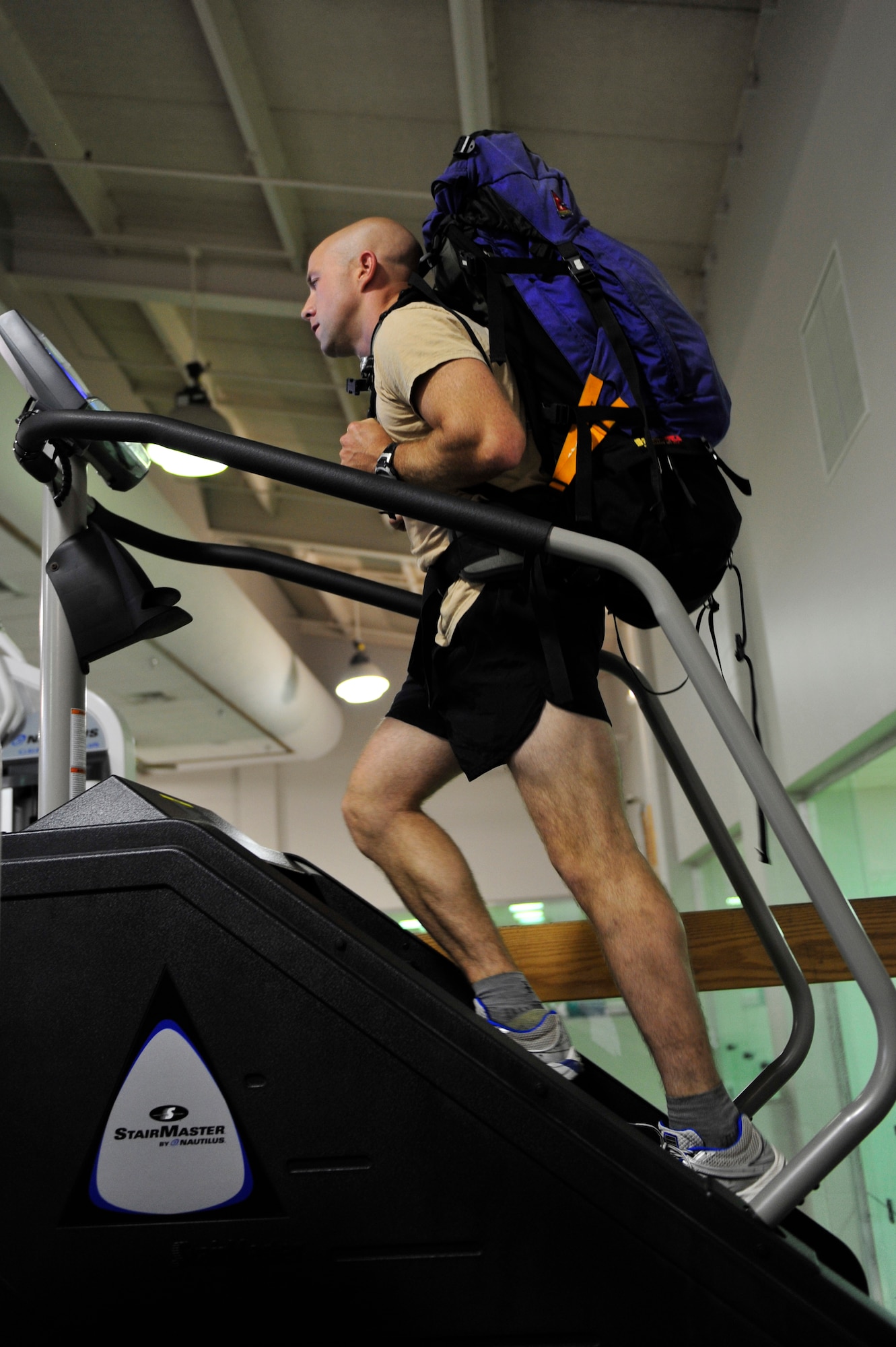 Capt. Rob Marshall, 8th Special Operations Squadron, uses the StairMaster at the Aderholt Fitness Center at Hurlburt Field, Fla., Oct. 28, 2010, while wearing a 60 pound pack in preparation for an upcoming mountaineering expedition to climb Vinson Massif, the highest mountain in Antarctica. Captain Marshall and Capt. Graydon Muller, 6th Special Operations Squadron, depart Nov. 24, 2010 to climb the 16,076 foot mountain as part of the U.S. Air Force Seven Summits Challenge, an effort for Air Force members to climb the highest mountain on each continent. (U.S. Air Force photo by Staff. Sgt. Stephanie Jacobs/RELEASED)