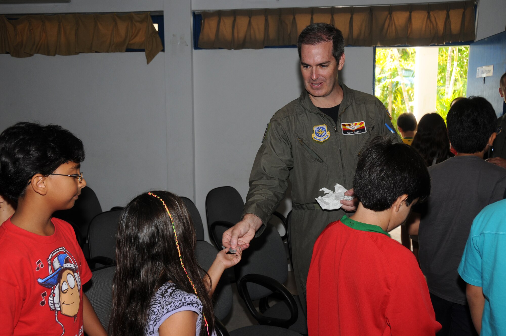 Major Quinn Casey of the 161st Air Refueling Wing, Phoenix, Ariz., hands out coins to students from the American School of Recife on November 17, 2010, in Recife, Brazil. The 161st ARW is participating in CRUZEX V, or Cruzeiro Do Sul (Southern Cross).  CRUZEX  is a multi-national combined exercise involving the Air Forces of Argentina, Brazil, Chile, France and Uruguay, and observers from numerous other countries with more than 82 aircraft and almost 3,000 Airmen involved.



U.S. Air Force Photo by Master Sgt. Kelly Deitloff

