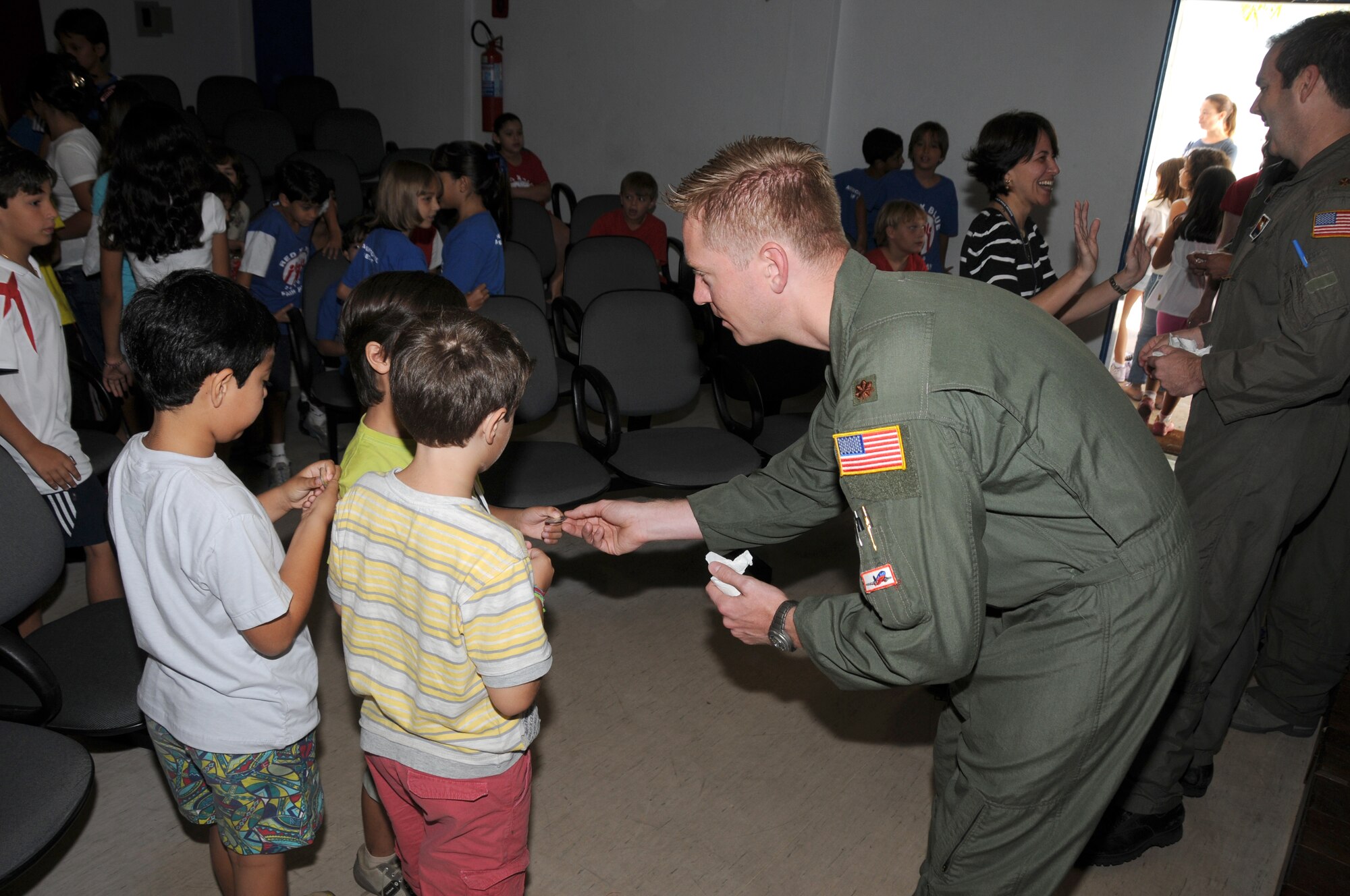 Major Steve Hutchinson of the 161st Air Refueling Wing, Phoenix, Ariz.,hands out coins to students from the American School of Recife on November 17, 2010, in Recife, Brazil. The 161st ARW is participating in CRUZEX V, or Cruzeiro Do Sul (Southern Cross).  CRUZEX  is a multi-national combined exercise involving the Air Forces of Argentina, Brazil, Chile, France and Uruguay, and observers from numerous other countries with more than 82 aircraft and almost 3,000 Airmen involved.



U.S. Air Force Photo by Master Sgt. Kelly Deitloff

