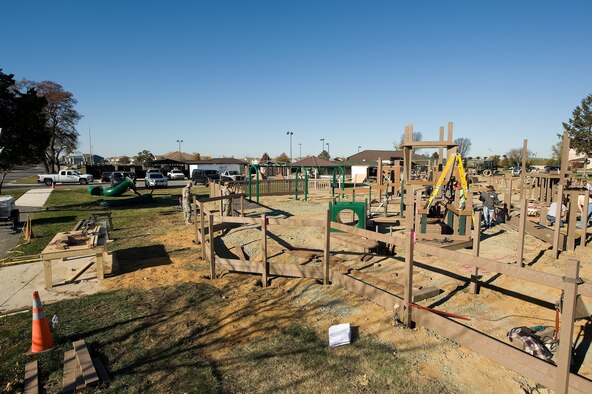 A new playground, being built next to the base swimming pool, takes shape on day fourth of construction at Dover AFB, De., Nov. 9, 2010. Wing leadership directed a portion of funds obtained from winning the 2010 Air Mobility Command's Commander-in-Chief's Award for Installation Excellence for the park’s construction.  The playground, designed by Leathers and Associates, features swings, slides and other play areas contained inside a huge shell resembling a large cargo military aircraft. It could be a C-17 or a C-5, depending on how you look at it. The park is being built by more than 900 base volunteers. (U.S. Air Force Photo/Jason Minto)