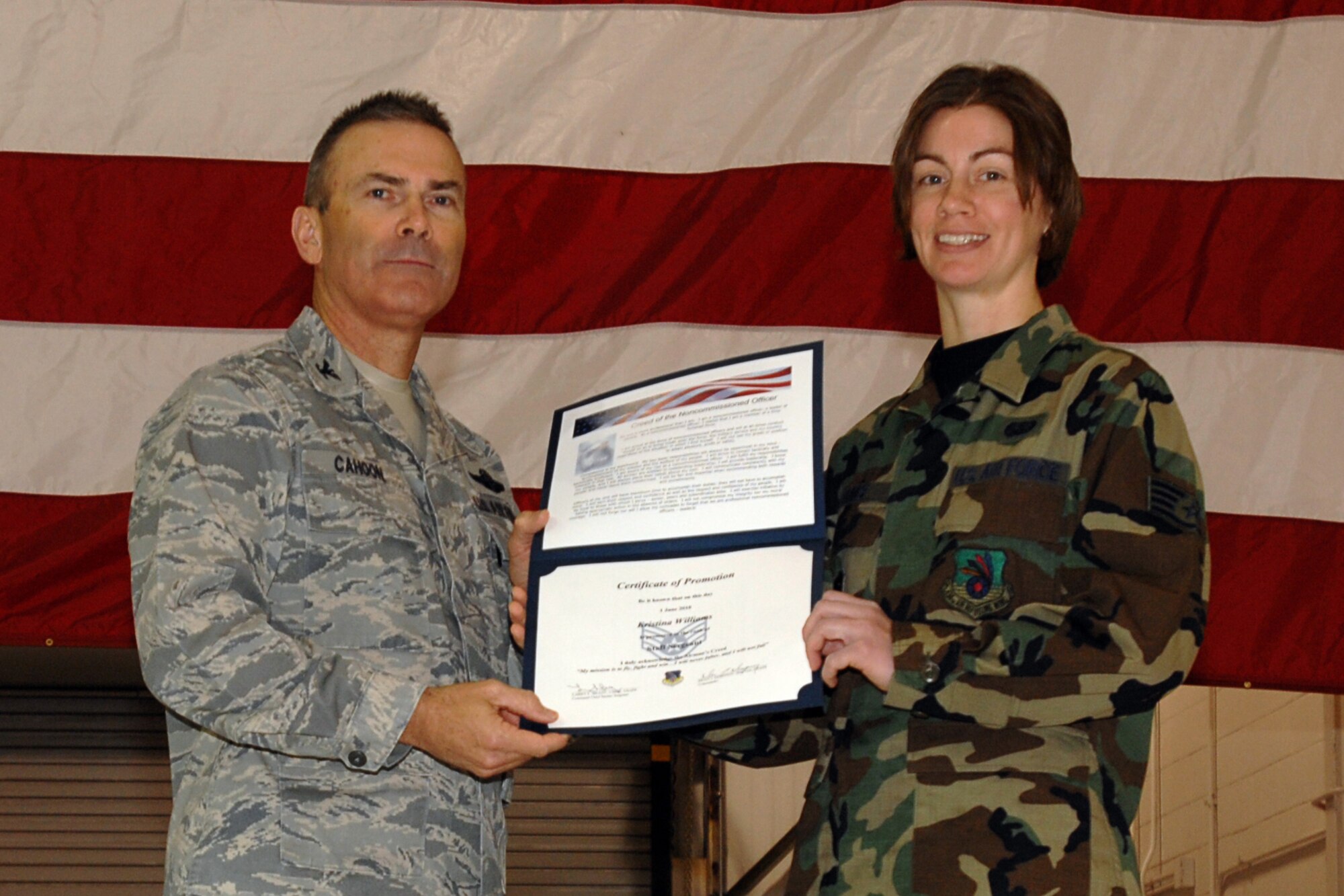 GRISSOM AIR RESERVE BASE, Ind. -- Col. William T. "Tim" Cahoon and Staff Sgt. Kristina Williams pose for a photo as Sergeant Williams is inducted into the ranks of noncommissioned officers during a special ceremony held here during the November unit training assembly. Sergeant Williams, a services specialist with the 434th Services Flight, along with 18 other Grissom Airmen, was recognized for their promotions to staff sergeant during the ceremony. Colonel Cahoon is the 434th Air Refueling Wing commander. (U.S. Air Force photo/Senior Airman Carl Berry)
