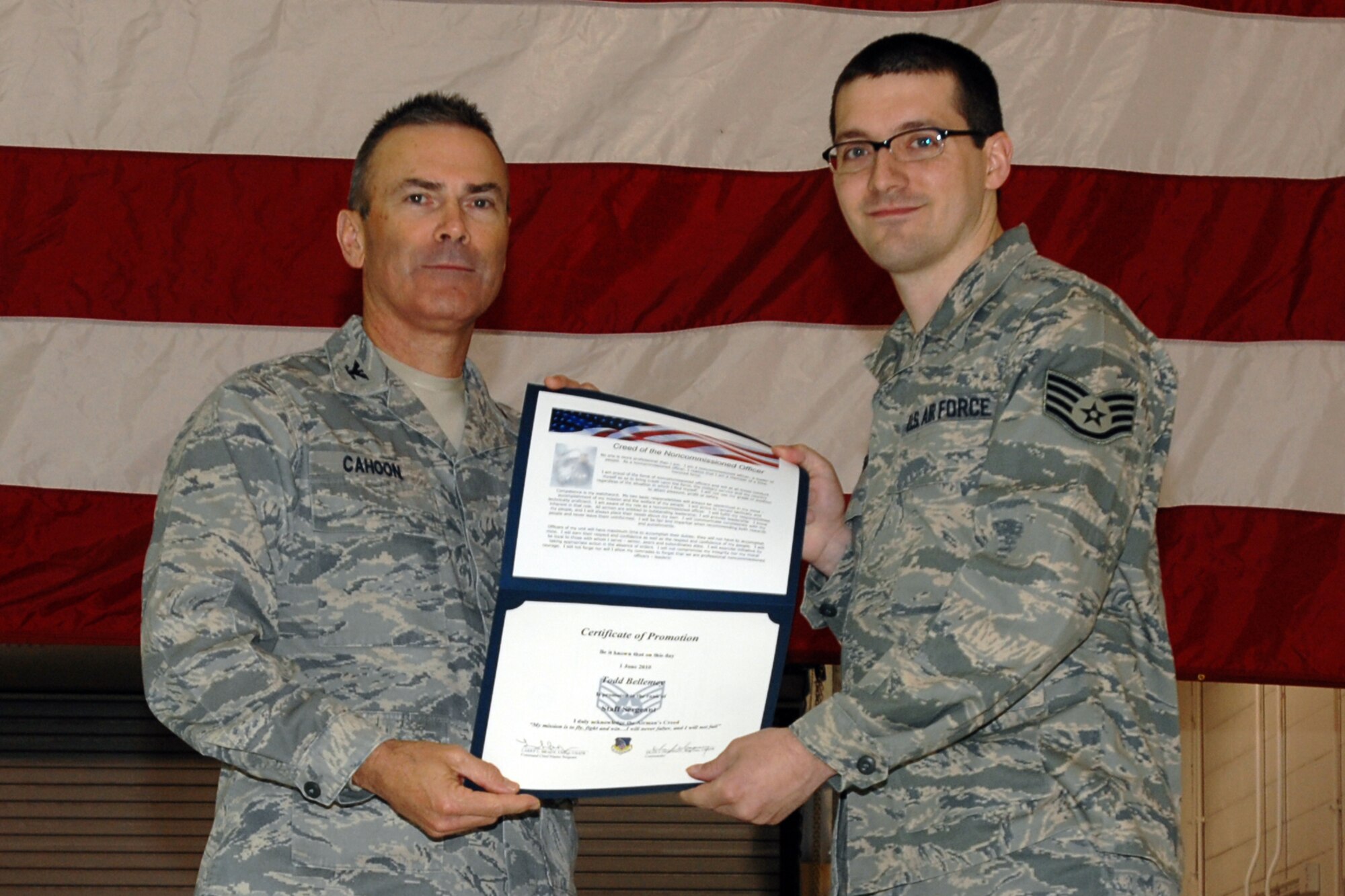 GRISSOM AIR RESERVE BASE, Ind. -- Col. William T. "Tim" Cahoon and Staff Sgt. Todd Bellemey pose for a photo as Sergeant Bellemey is inducted into the ranks of noncommissioned officers during a special ceremony held here during the November unit training assembly. Sergeant Bellemey, a ground radio communications specialist with the 434th Communications Squadron, along with 18 other Grissom Airmen, was recognized for their promotions to staff sergeant during the ceremony. Colonel Cahoon is the 434th Air Refueling Wing commander. (U.S. Air Force photo/Senior Airman Carl Berry)
