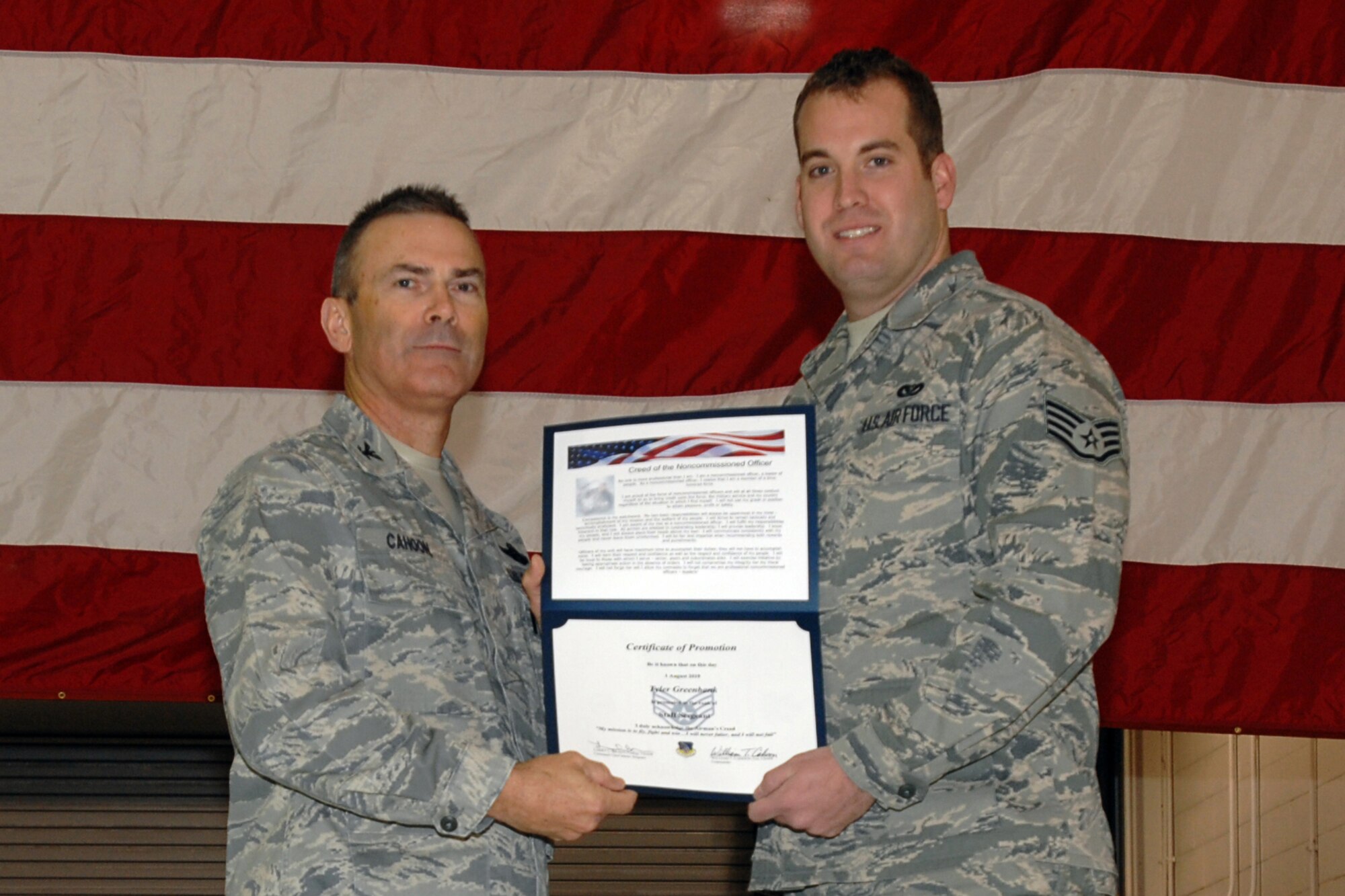 GRISSOM AIR RESERVE BASE, Ind. -- Col. William T. "Tim" Cahoon and Staff Sgt. Tyler Greenbank pose for a photo as Sergeant Greenbank is inducted into the ranks of noncommissioned officers during a special ceremony held here during the November unit training assembly. Sergeant Greenbank, a aircrew flight equipment specialist with the 434th Operations Support Squadron, along with 18 other Grissom Airmen, was recognized for their promotions to staff sergeant during the ceremony. Colonel Cahoon is the 434th Air Refueling Wing commander. (U.S. Air Force photo/Senior Airman Carl Berry)
