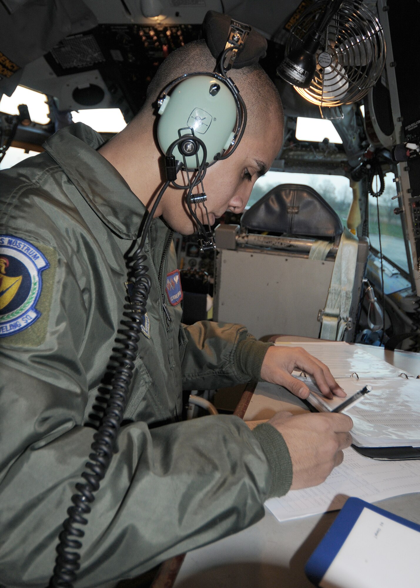 Airman 1st Class Ronnie Echavarria, a 351st Air Refueling Squadron KC-135 Stratotanker boom operator, starts his mission paperwork before an air refueling training mission Nov. 12, 2010, at Royal Air Force Mildenhall, England. The crew of the KC-135 participated in the refueling training mission along with a C-17 Globemaster III from the Heavy Airlift Wing at Papa Air Base, Hungary. Boom operators at RAF Mildenhall rarely get the opportunity to refuel heavy aircraft. (U.S. Air Force photo/Senior Airman Tabitha M. Lee)