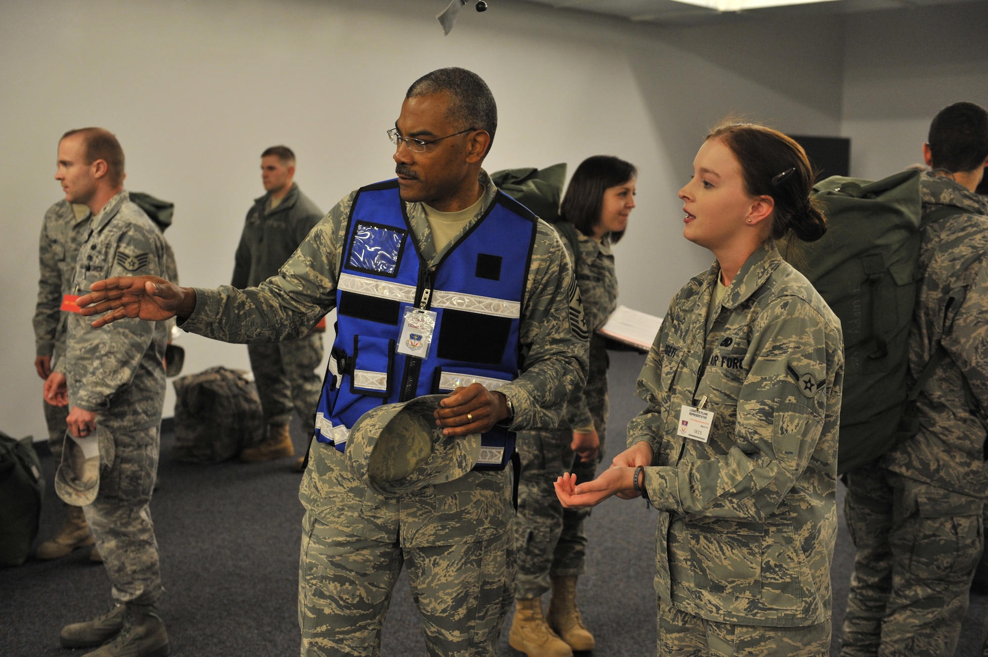 Chief Master Sgt. Jack Johnson discusses the deployment line process with Airman Paige Garrett, 341st Logistics Readiness Squadron logistics plans apprentice, Nov. 10 at building 3080 during the recent Global Thunder exercise.  (U.S. Air Force photo/ John Turner)