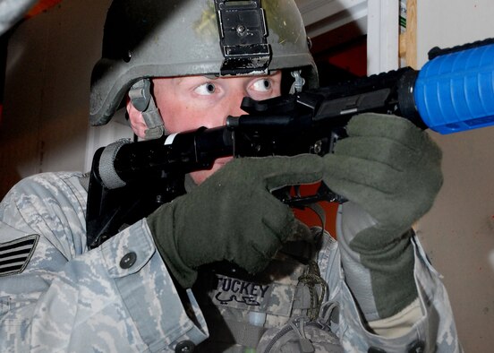 Staff Sgt. Jeffrey Tuckey, 741st Missile Security Forces Squadron convoy response force leader, scans for threats during a room-clearing exercise Oct. 29 in the "Shoot House." Sergeant Tuckey is among the Defenders who were hand-picked to represent Malmstrom during the 2010 Global Strike Challenge competition. (U.S. Air Force photo/Staff Sgt. Dillon White)