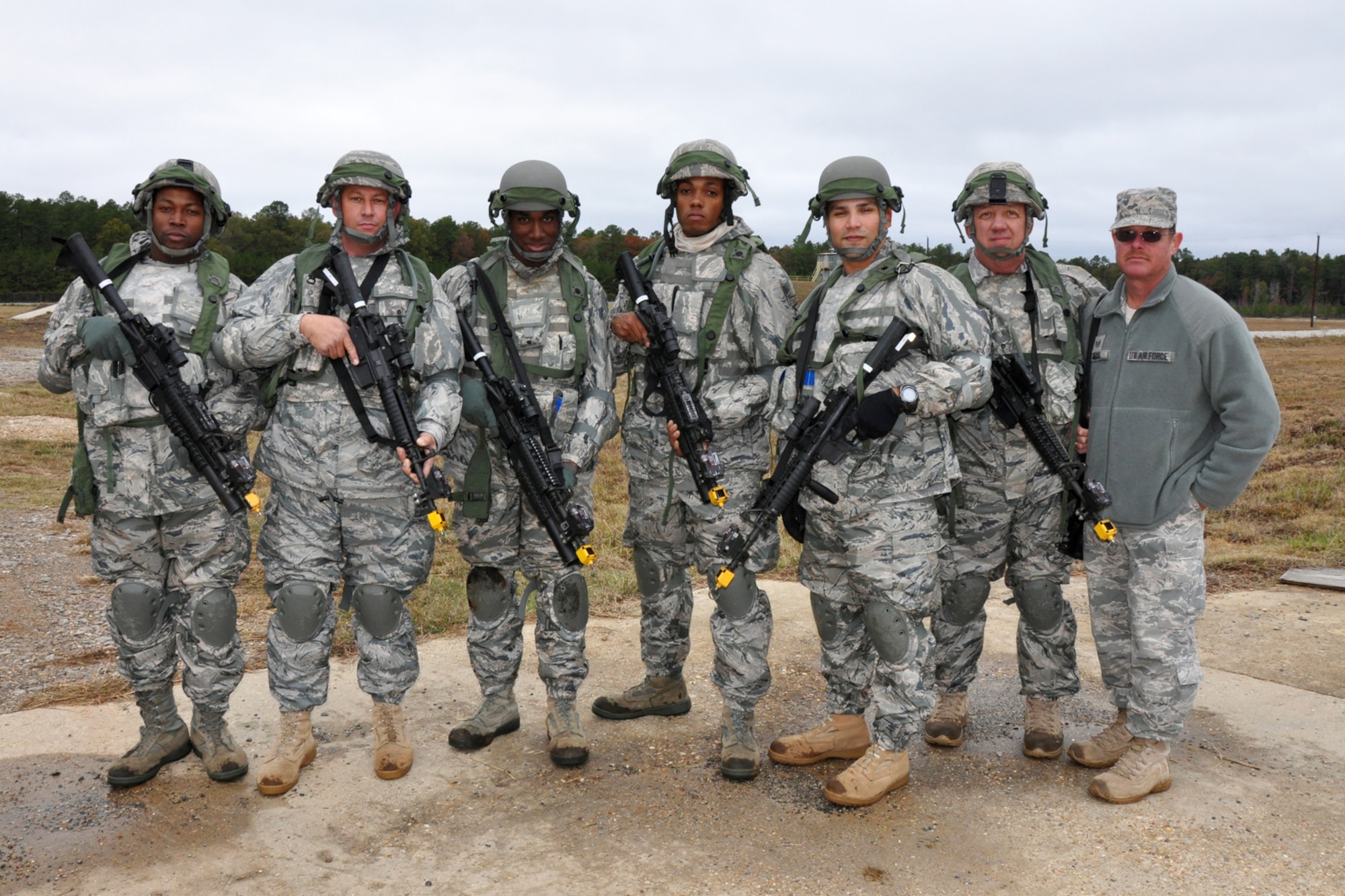 Members of the 917th Security Forces Squadron from Barksdale Air Force Base, La., pose for a picture after completing their portion of the Firing and Tactics Event of the first-ever Global Strike Challenge, at Camp Minden in Louisiana, Nov. 13, 2010. Airman First Class Jafus Sheridan, Technical Sgt. Chad Turner, Airman First Class Trevor Forman, Airman First Class Colby Newborn, Technical Sgt. Daniel Zamora, team leader, Technical Sgt. Melvin Cargill and Staff Sgt. David Mudd, who was the alternate, made up the tactics team from 917th SFS. A six-man team from the 917th SFS competed in the event against other teams from numerous bases involved in the competition. The Multiple Integrated Laser Engagement System or MILES, which uses lasers and blank cartridges to simulate actual battle, was used for the event to identify the Airmen who were killed. This system is used by the U.S. military and other armed forces around the world for training purposes. (U.S. Air Force photo/Tech. Sgt. Jeff Walston)