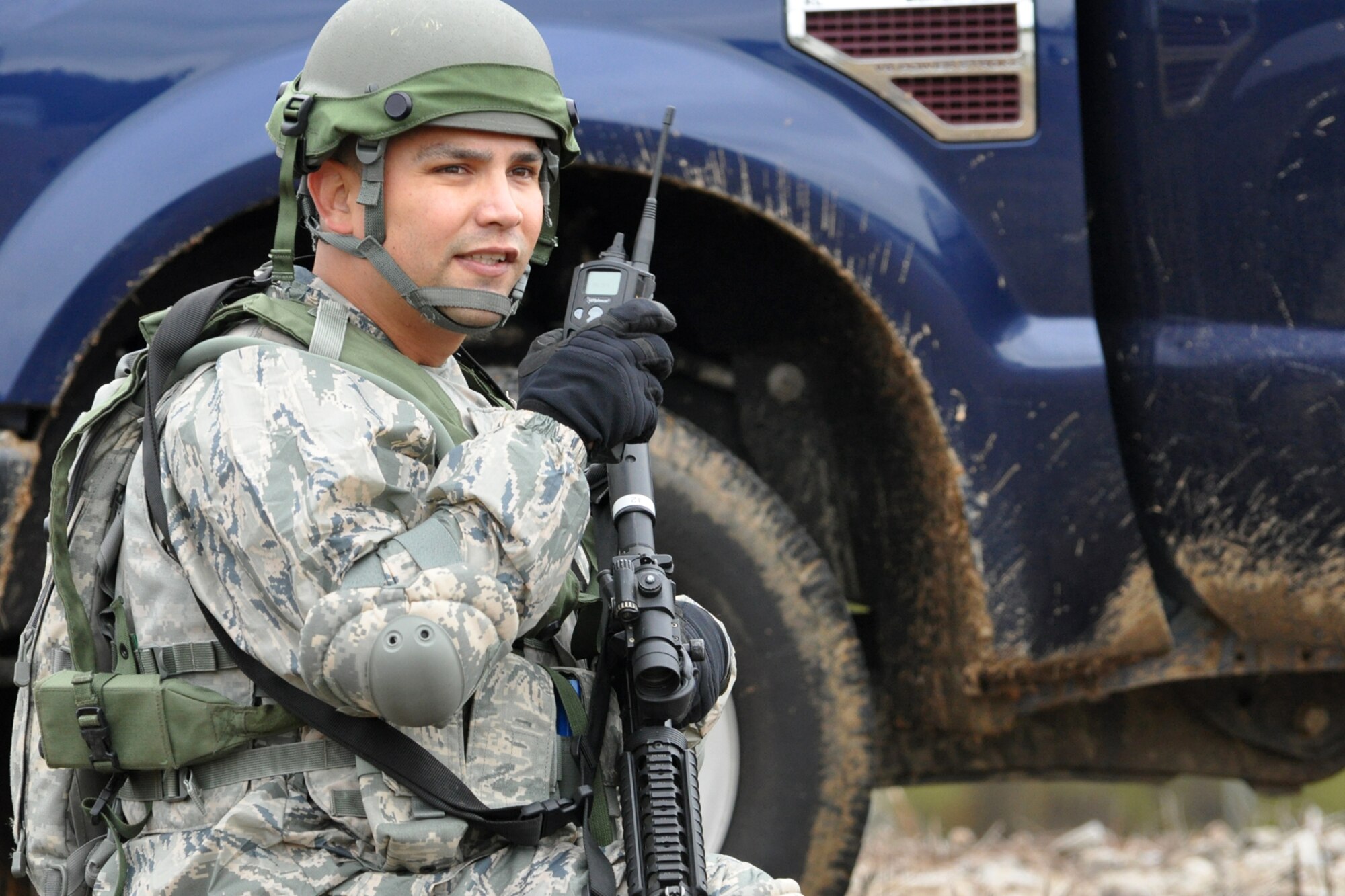 Technical Sgt. Daniel Zamora, team leader, 917th Security Forces Squadron tactics team, contacts members of his unit during a firefight at a Firing and Tactics Event at Camp Minden in Louisiana, Nov. 13, 2010. The event was part of the first-ever Global Strike Challenge, which wrapped up at Barksdale Air Force Base, La., Nov. 17, 2010. A six-man team from the 917th SFS competed in the event against other teams from numerous bases involved in the competition. The Multiple Integrated Laser Engagement System or MILES, which uses lasers and blank cartridges to simulate actual battle, was used for the event to identify the Airmen who were killed. This system is used by the U.S. military and other armed forces around the world for training purposes. (U.S. Air Force photo/Tech. Sgt. Jeff Walston)