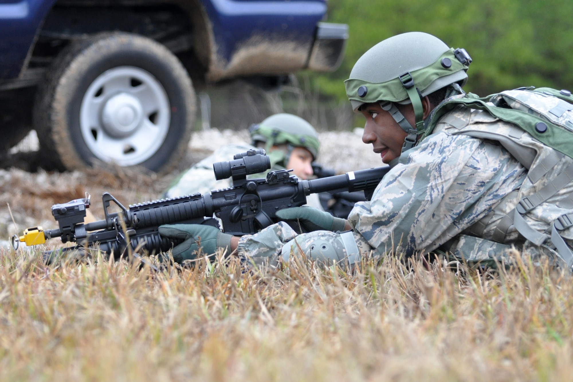 Airman First Class Trevor Forman (right) maintains situational awareness as Technical Sgt. Daniel Zamora, team leader for the 917th Security Forces Squadron tactics team, gathers information from team members and consolidates his unit after a firefight with aggressor forces during the Firing and Tactics Event at Camp Minden in Louisiana, Nov. 13, 2010. The event was part of the first-ever Global Strike Challenge, which wrapped up at Barksdale Air Force Base, La., Nov. 17, 2010. A six-man team from the 917th SFS competed in the event against other teams from numerous bases involved in the competition. (U.S. Air Force photo/Tech. Sgt. Jeff Walston)