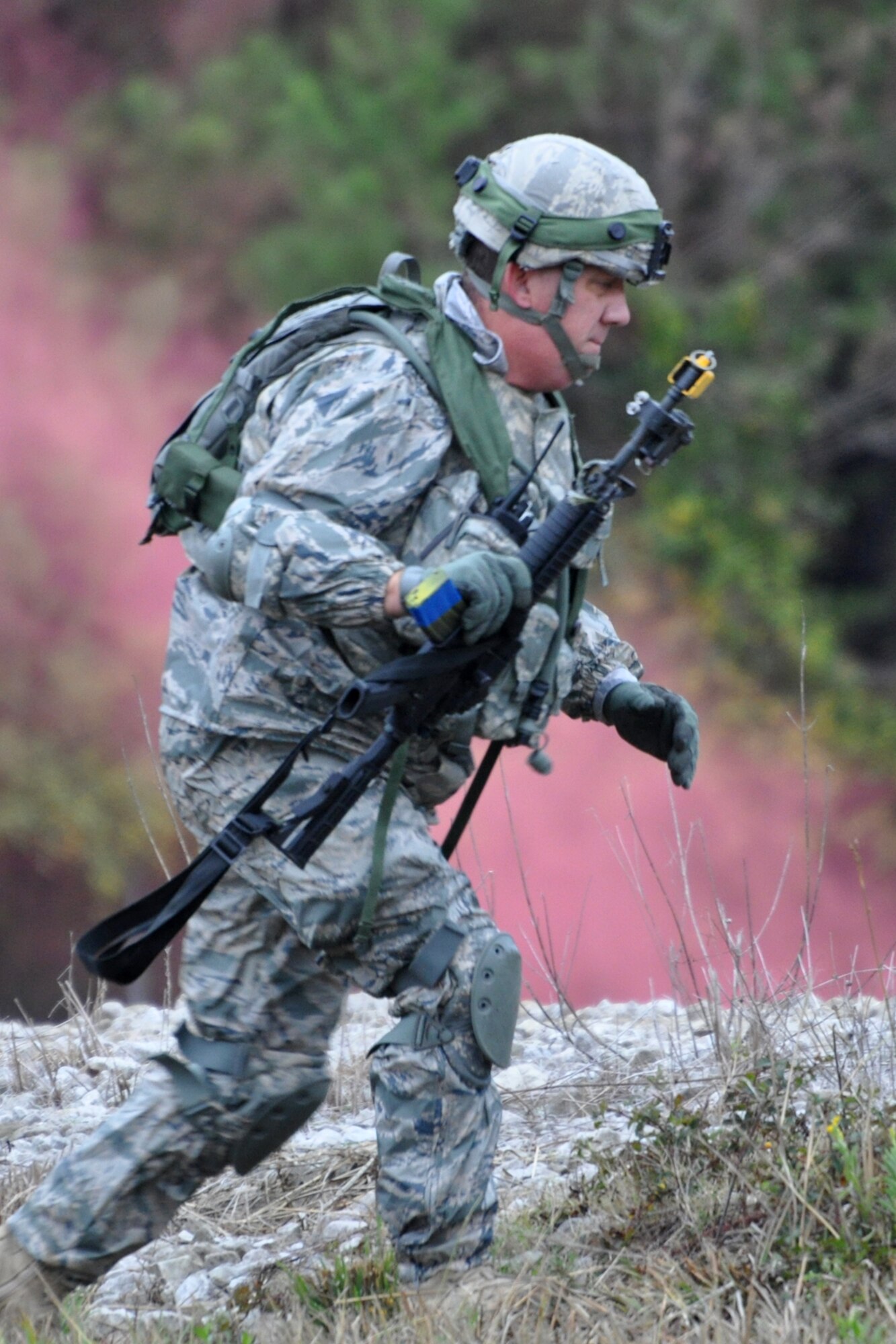 Technical Sgt. Melvin Cargill, 917th Security Forces Squadron tactics team, moves to another position for cover after taking out several member of an aggressor force during the Firing and Tactics Event at Camp Minden in Louisiana, Nov. 13, 2010. The event was part of the first-ever Global Strike Challenge, which wrapped up at Barksdale Air Force Base, La., Nov. 17, 2010. A six-man team from the 917th SFS competed in the event against other teams from numerous bases involved in the competition. The Multiple Integrated Laser Engagement System or MILES, which uses lasers and blank cartridges to simulate actual battle, was used for the event to identify the Airmen who were killed. This system is used by the U.S. military and other armed forces around the world for training purposes. (U.S. Air Force photo/Tech. Sgt. Jeff Walston)