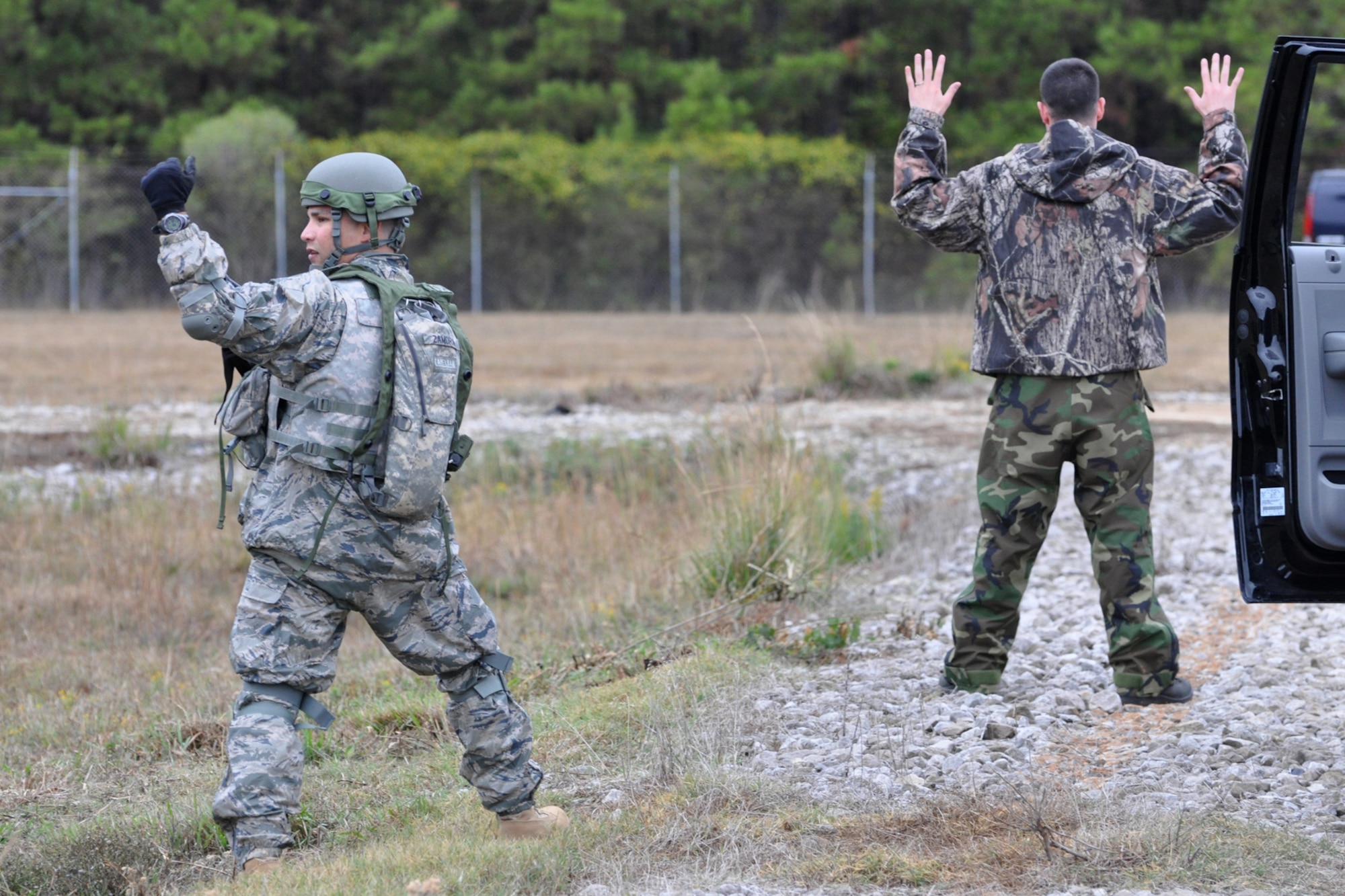 Technical Sgt. Daniel Zamora, team leader, 917th Security Forces Squadron tactics team, calls for back-up after stopping a vehicle during the Firing and Tactics Event at Camp Minden in Louisiana, Nov. 13, 2010. The event was part of the first-ever Global Strike Challenge, which wrapped up at Barksdale Air Force Base, La., Nov. 17, 2010. A six-man team from the 917th SFS competed in the event against other teams from numerous bases involved in the competition. (U.S. Air Force photo/Tech. Sgt. Jeff Walston)