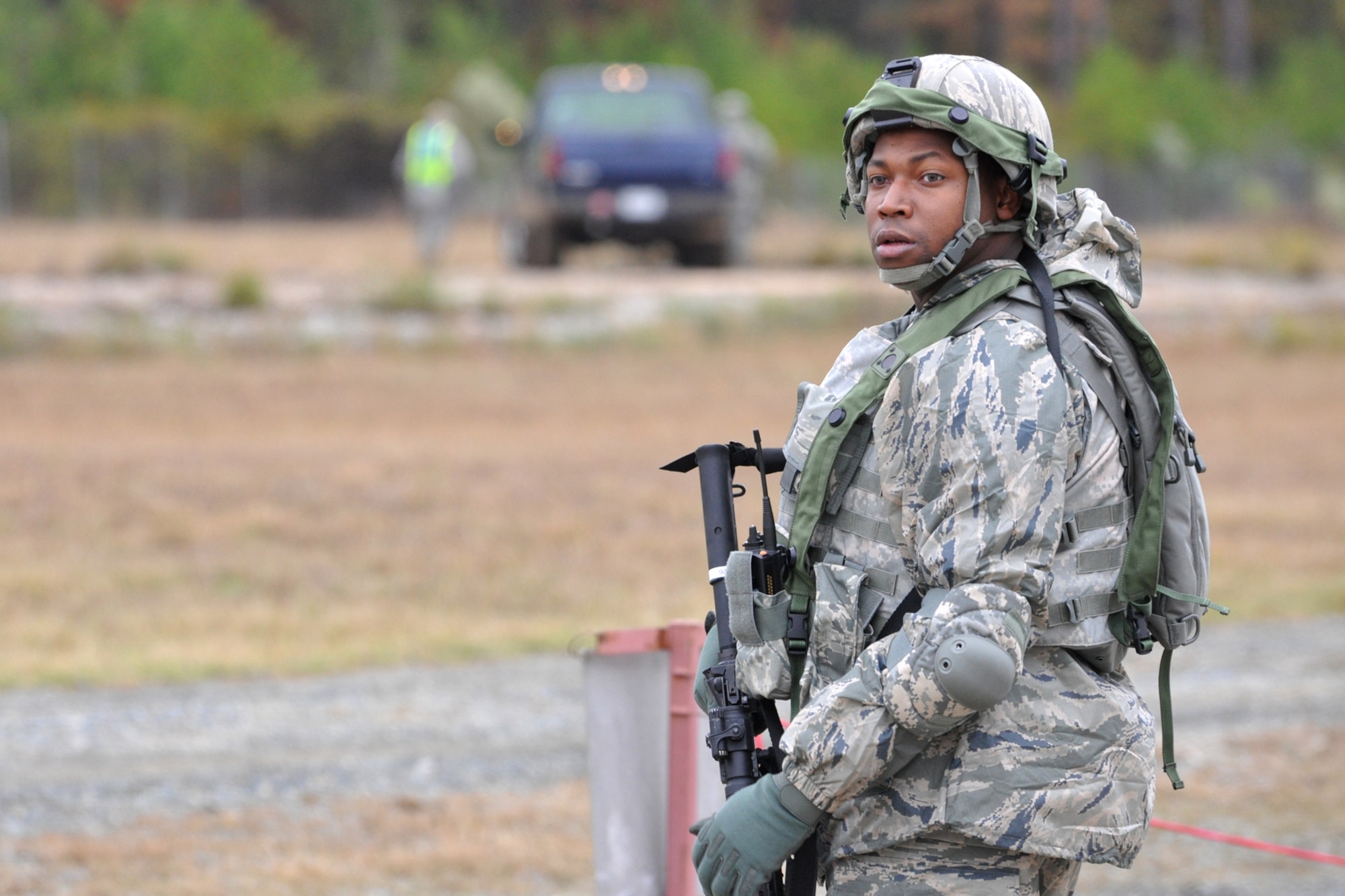 Airman First Class Jafus Sheridan, 917th Security Forces Squadron, from Barksdale Air Force Base, La., keeps an eye out for trouble while securing his objective during the Firing and Tactics Event at Camp Minden in Louisiana, Nov. 13, 2010. The event was part of the first-ever Global Strike Challenge, which wrapped up at Barksdale Air Force Base, La., Nov. 17, 2010. A six-man team from the 917th SFS competed in the event against other teams from numerous bases involved in the competition. (U.S. Air Force photo/Tech. Sgt. Jeff Walston)