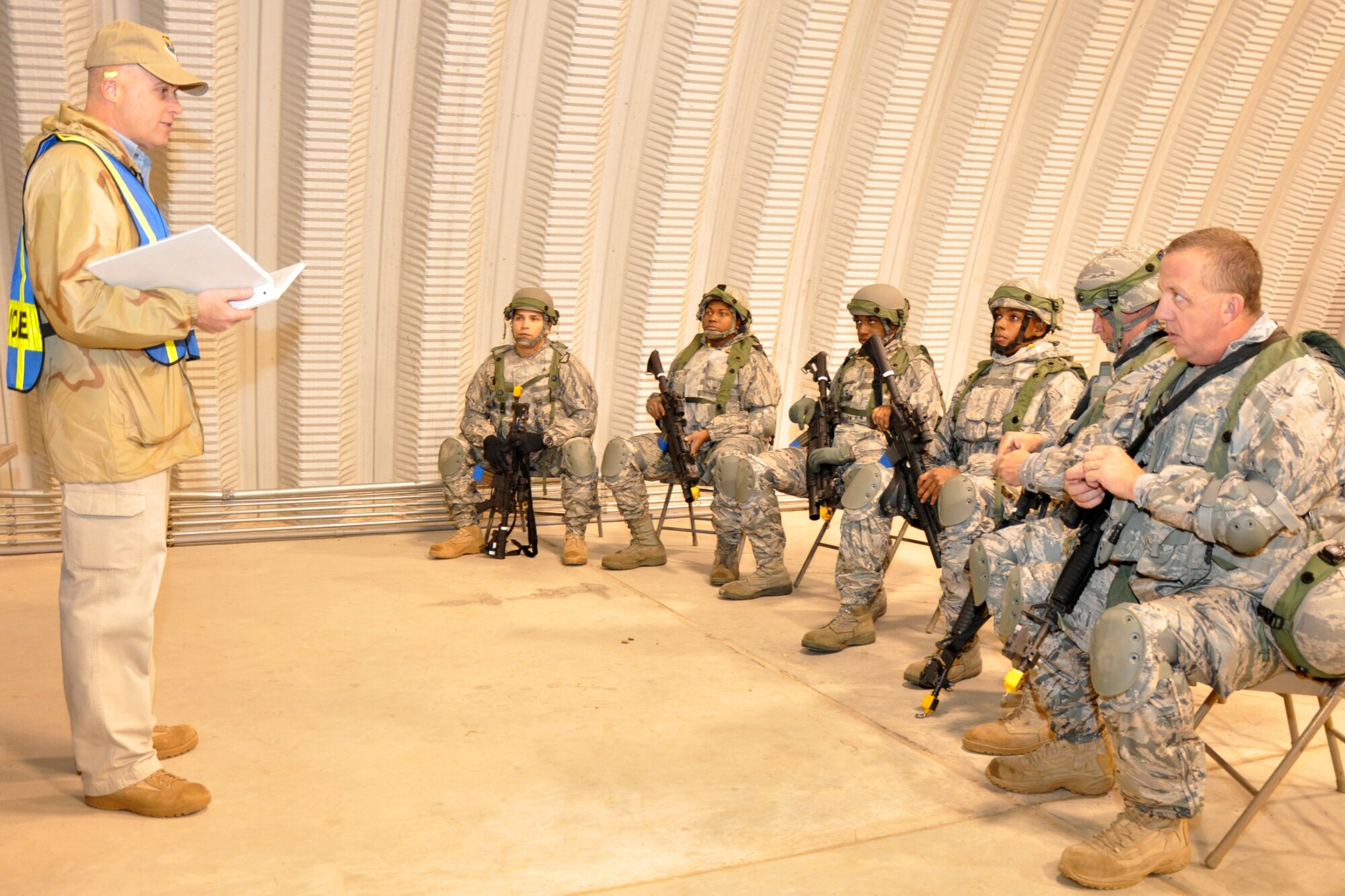 Chief Master Sgt. (Ret) Todd Kabalan, tactics event coordinator, for the first-ever Global Strike Challenge, briefs the tactics team from the 917th Security Forces Squadron before they compete in the Firing and Tactics Event at Camp Minden in Louisiana, Nov. 13, 2010. The 917 SFS is from Barksdale Air Force Base, La. A six-man team from the 917th SFS competed in the event against other teams from numerous bases involved in the competition. (U.S. Air Force photo/Tech. Sgt. Jeff Walston)