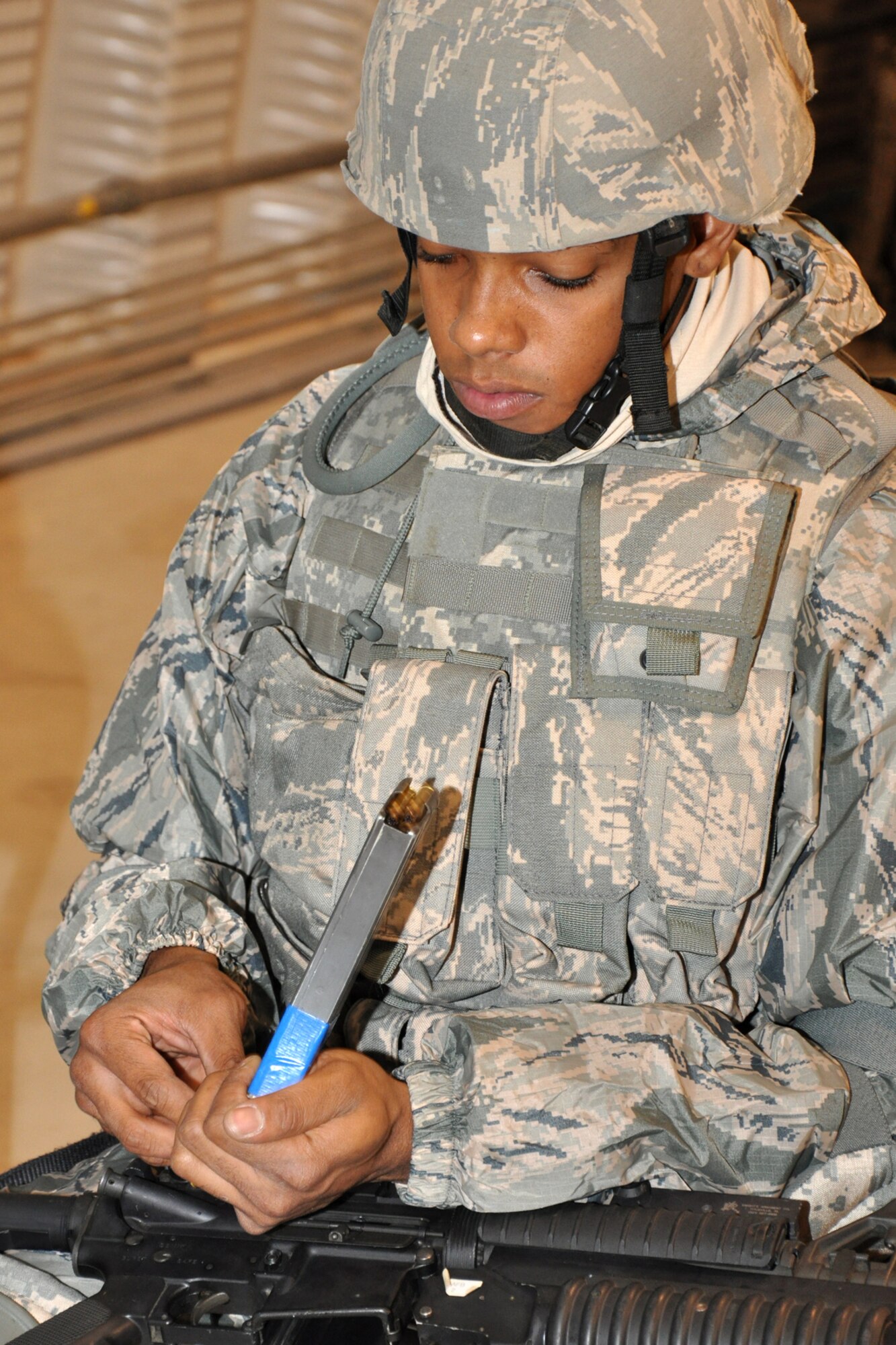 Airman First Class Colby Newborn, with the 917th Security Forces Squadron at Barksdale Air Force Base, La., loads a clip with blanks in preparation for the Firing and Tactics Event at Camp Minden in Louisiana, Nov. 13, 2010. The event was part of the first-ever Global Strike Challenge, which wrapped up at Barksdale Air Force Base, La., Nov. 17, 2010. A six-man team from the 917th SFS competed in the event against other teams from numerous bases involved in the competition. (U.S. Air Force photo/Tech. Sgt. Jeff Walston)