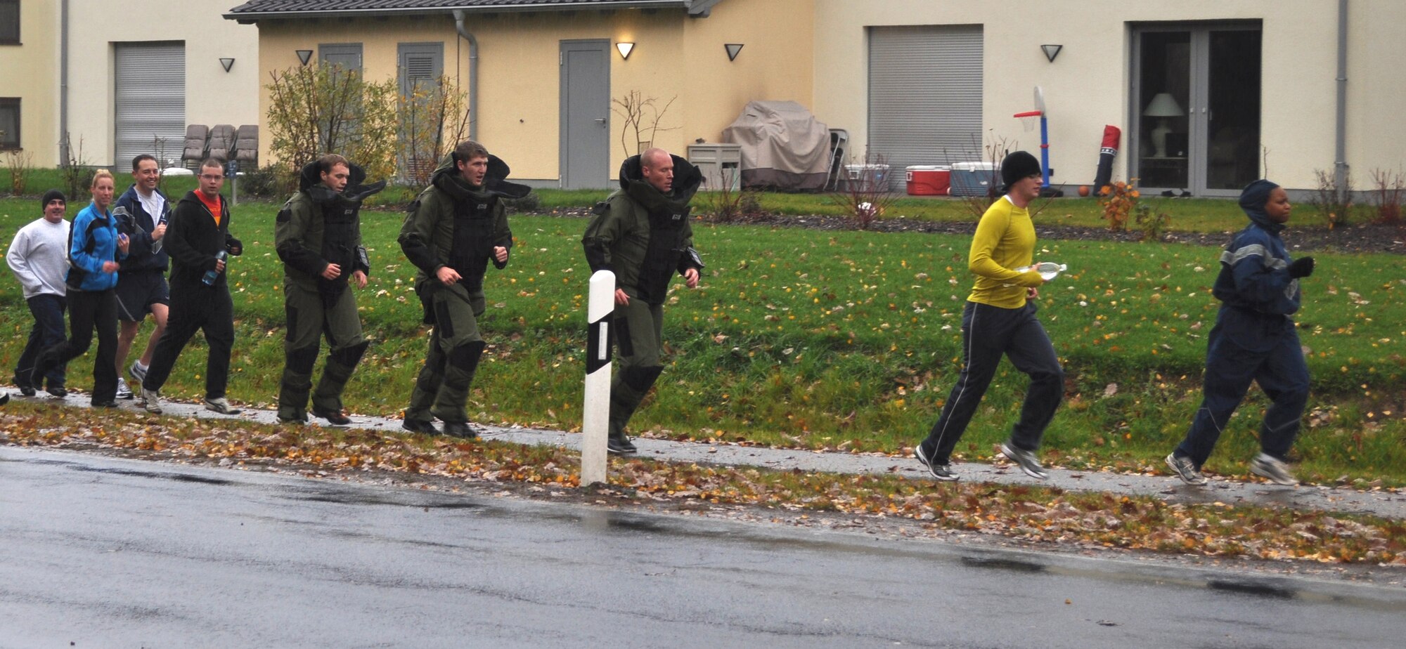 SPANGDAHLEM AIR BASE, Germany – Members of the 52nd Civil Engineer Squadron explosive ordnance disposal flight run in bomb suits during a five-kilometer charity event Nov. 9. The more than $3,500 raised during the run benefited the Landstuhl Fisher House through the Combined Federal Campaign. (U.S. Air Force photo)