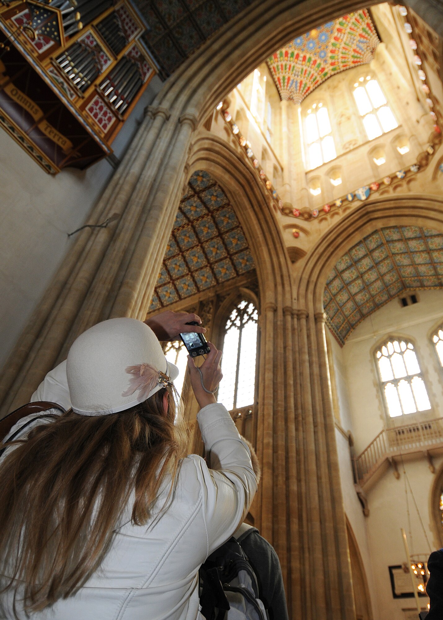 RAF MILDENHALL, England -- Cathy Bradley, RAF Mildenhall newcomer, photographs the inside of the tower of the St. Edmundsbury Cathedral in Bury St. Edmunds Nov. 11, 2010.   A tour of the cathedral is part of the Newcomer's Bury Bus Tour offered by the Airman and Family Readiness Center.  (U.S. Air Force photo/Senior Airman Tabitha M. Lee)
