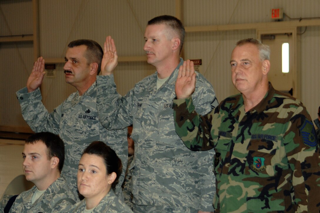 GRISSOM AIR RESERVE BASE, Ind. -- From left, Master Sgts. Rodney Waikel, Charles Drane and John E. Bitzel, Jr., recite a senior noncommissioned officer pledge during a special induction ceremony held during the November unit training assembly. The ceremony recognized the three new master sergeants as senior NCOs.  Sergeant Waikel is a pneudraulic systems supervisor with the 434th Maintenance Squadron; Sergeant Drane is a KC-135R Stratotanker crew chief with the 434t Aircraft Maintenance Squadron; and Sergeant Bitzel is a combat crew communications specialist with the 434th Operations Support Squadron.  (U.S. Air Force photo/Senior Airman Carl Berry)
